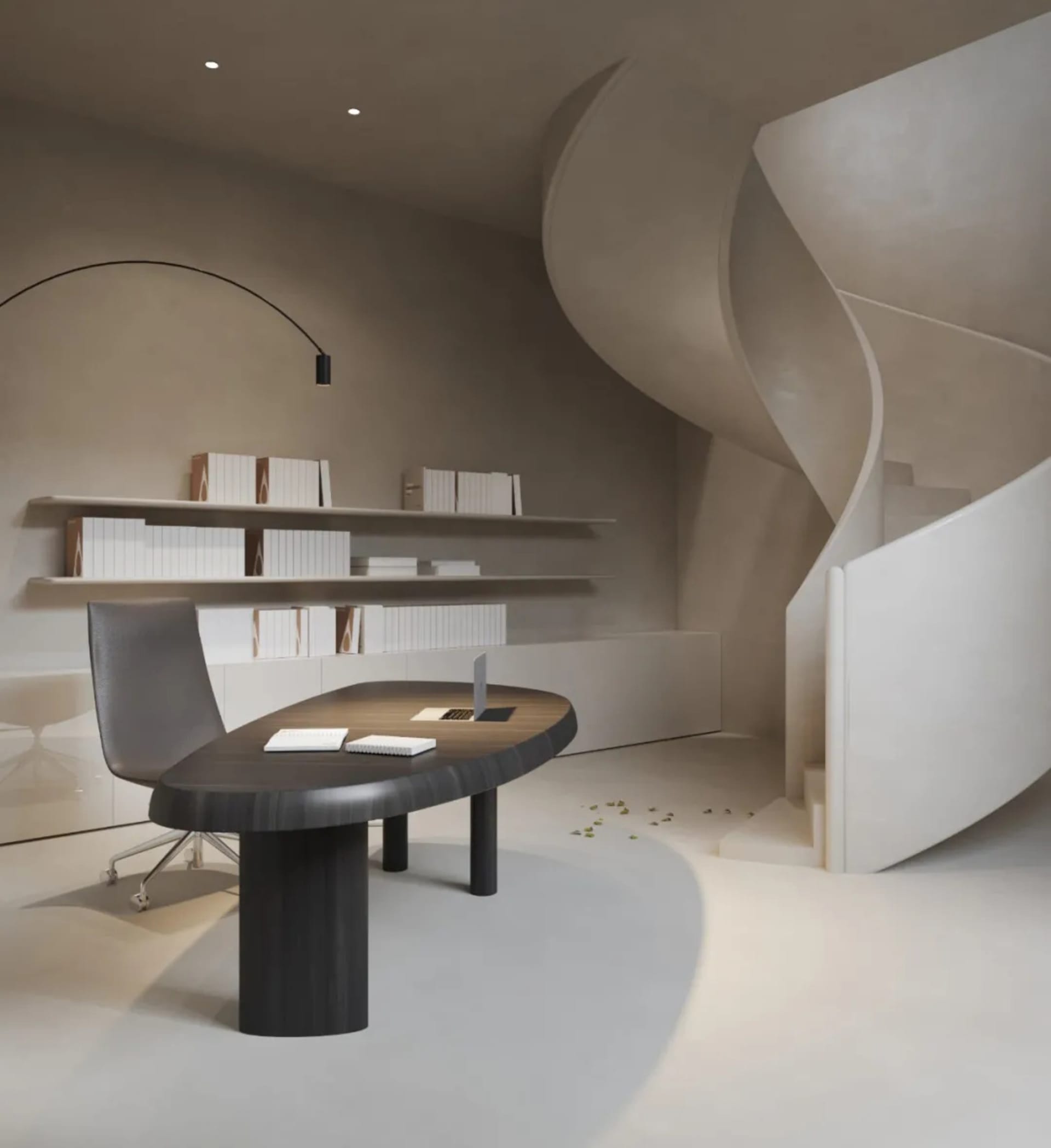 A modern, minimalist home office with a concrete desk, gray chair, and floating bookshelves.