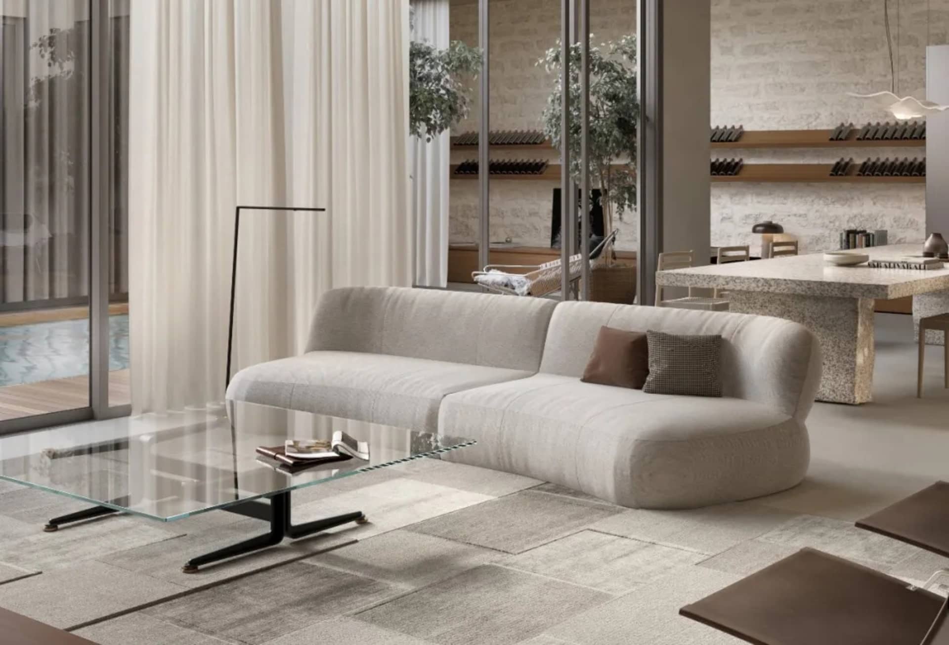 A modern living room featuring a stylish couch, glass coffee table, and minimalist decor.