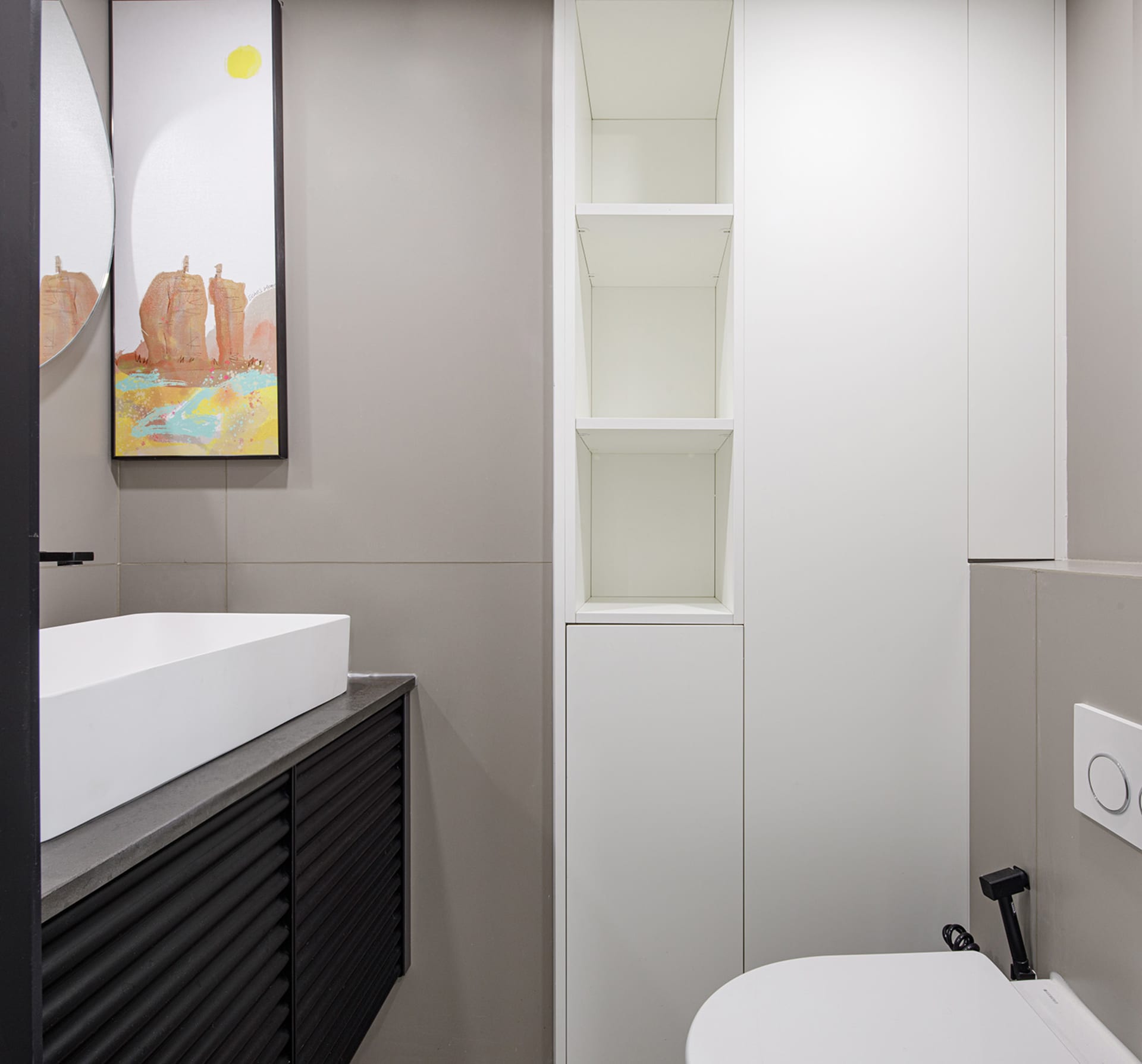 A modern minimalist bathroom with a white concrete countertop and white cabinets.