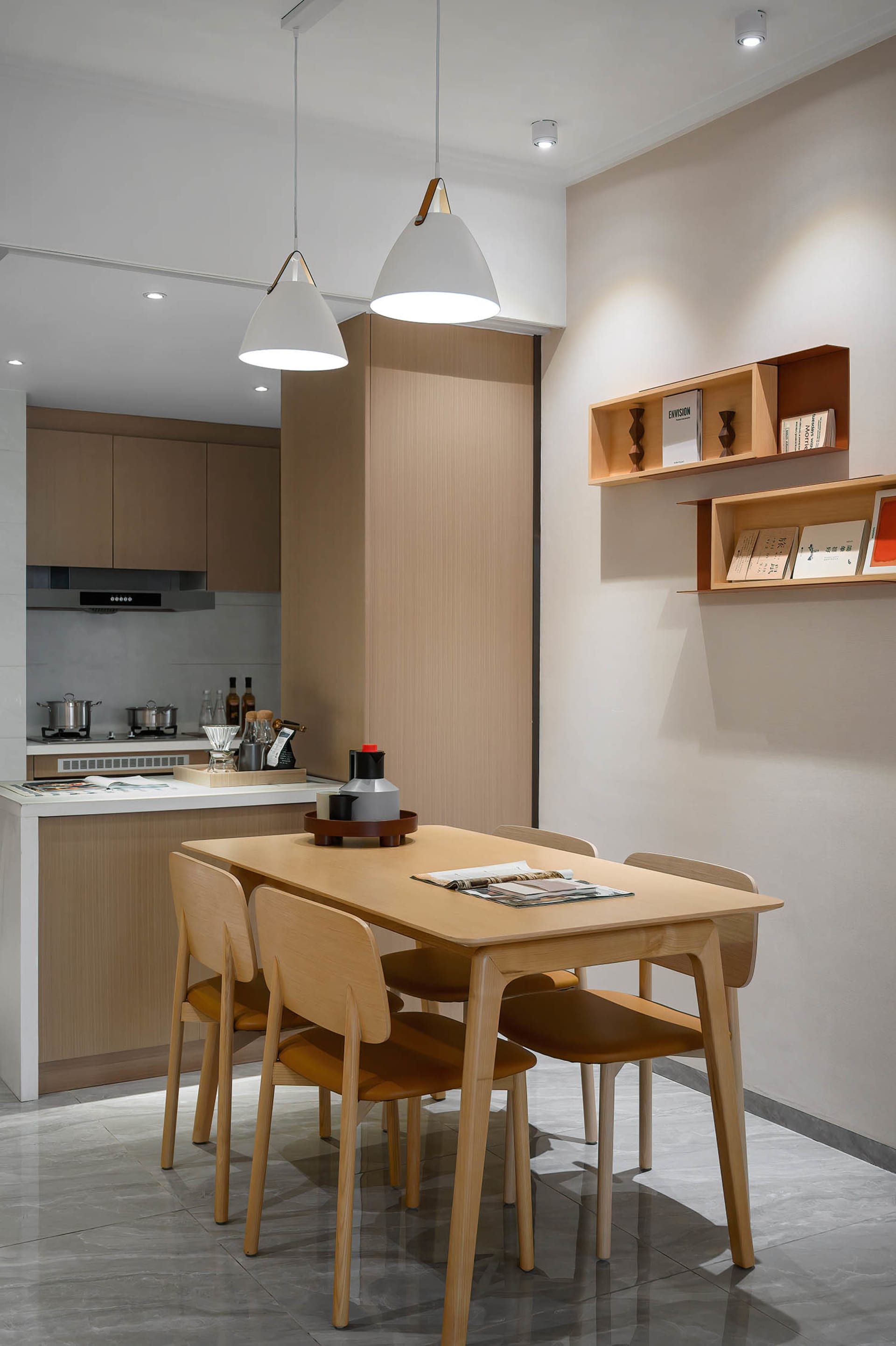 Modern minimalist kitchen featuring wooden furniture and a marble countertop