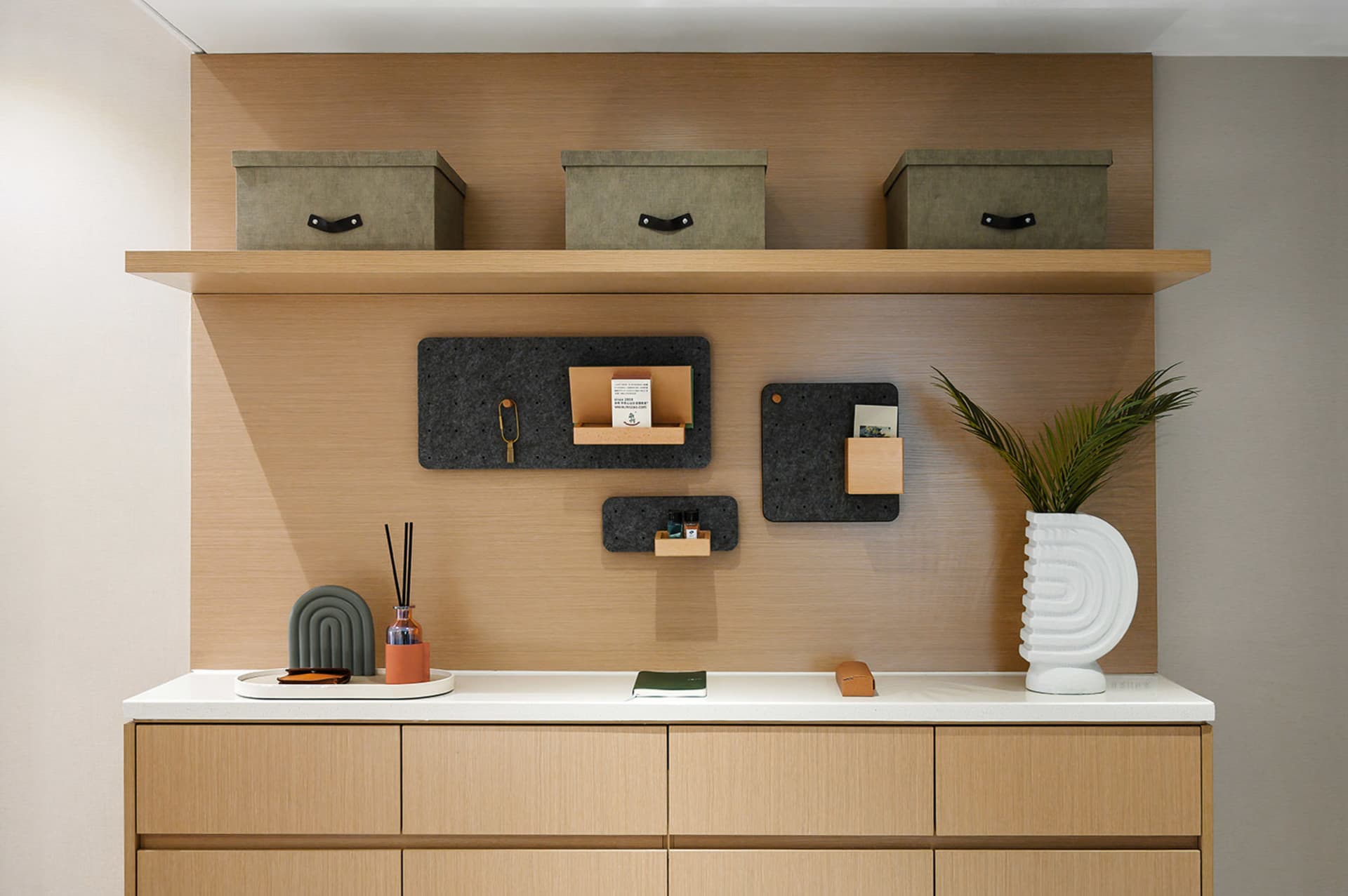 A modern office space featuring wood surfaces, cork accents, and concrete elements.