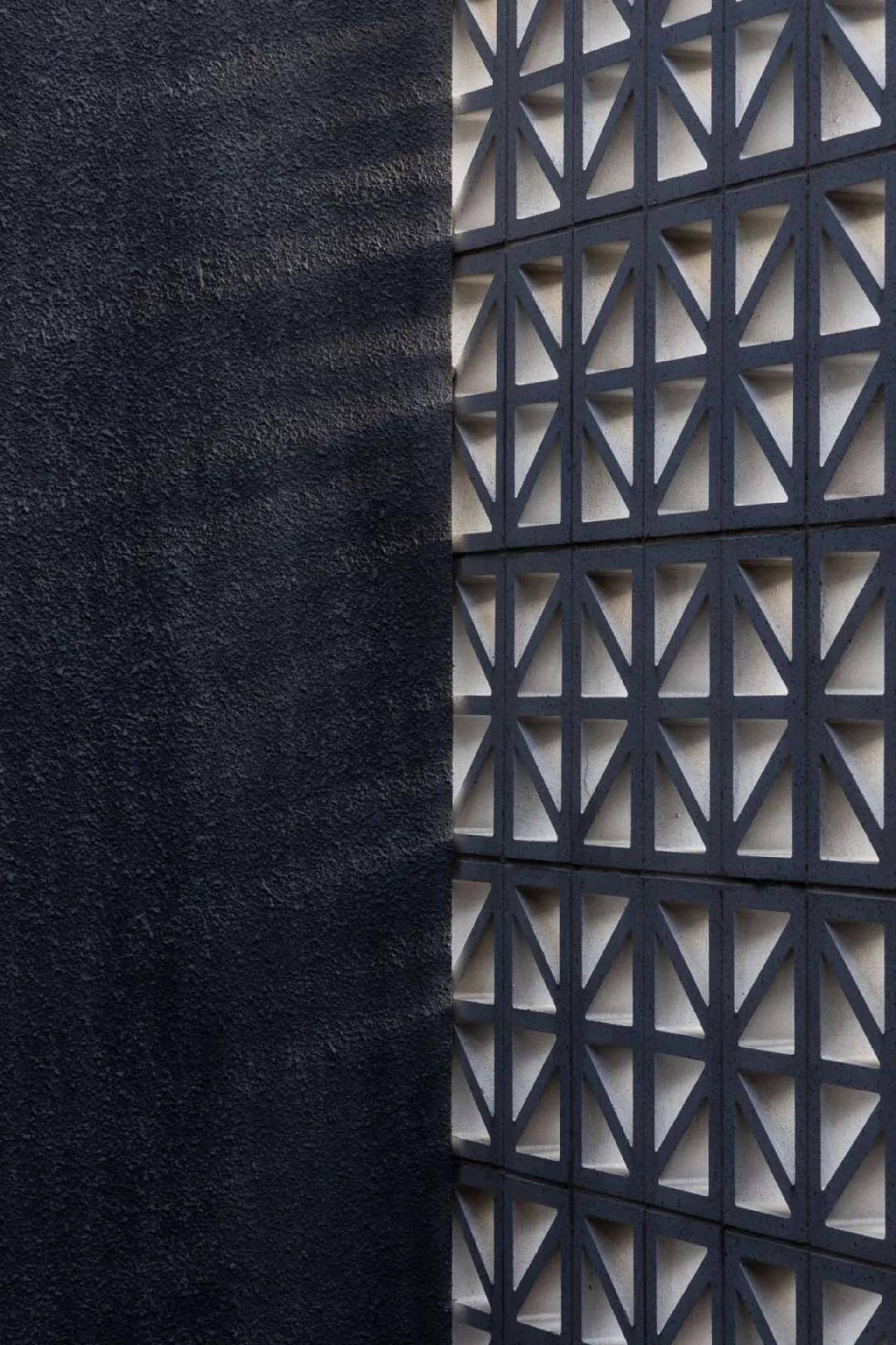 A concrete wall with geometric patterns
