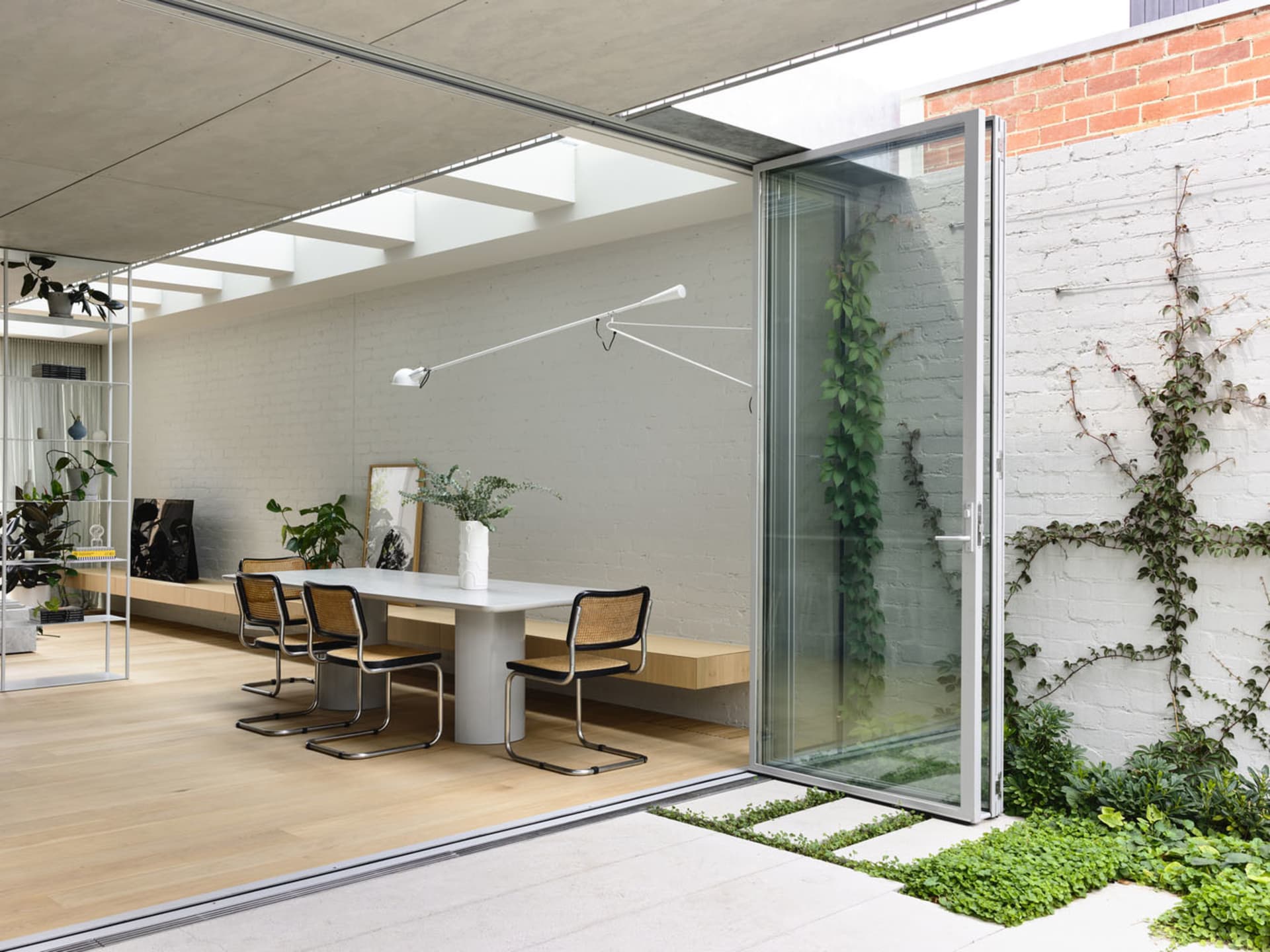 A modern living space featuring concrete structures and furniture.