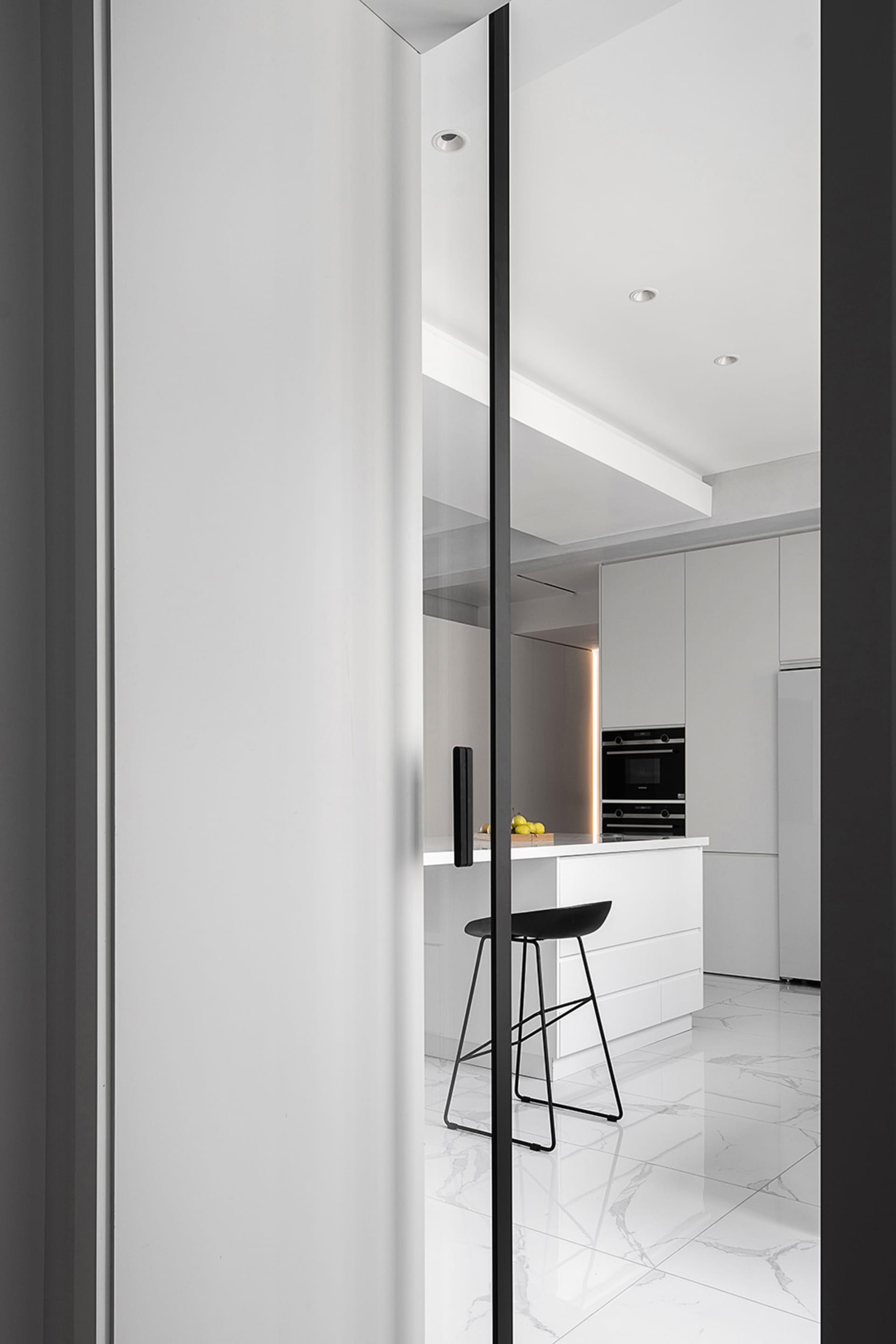Modern kitchen interior with marble flooring and minimalist design