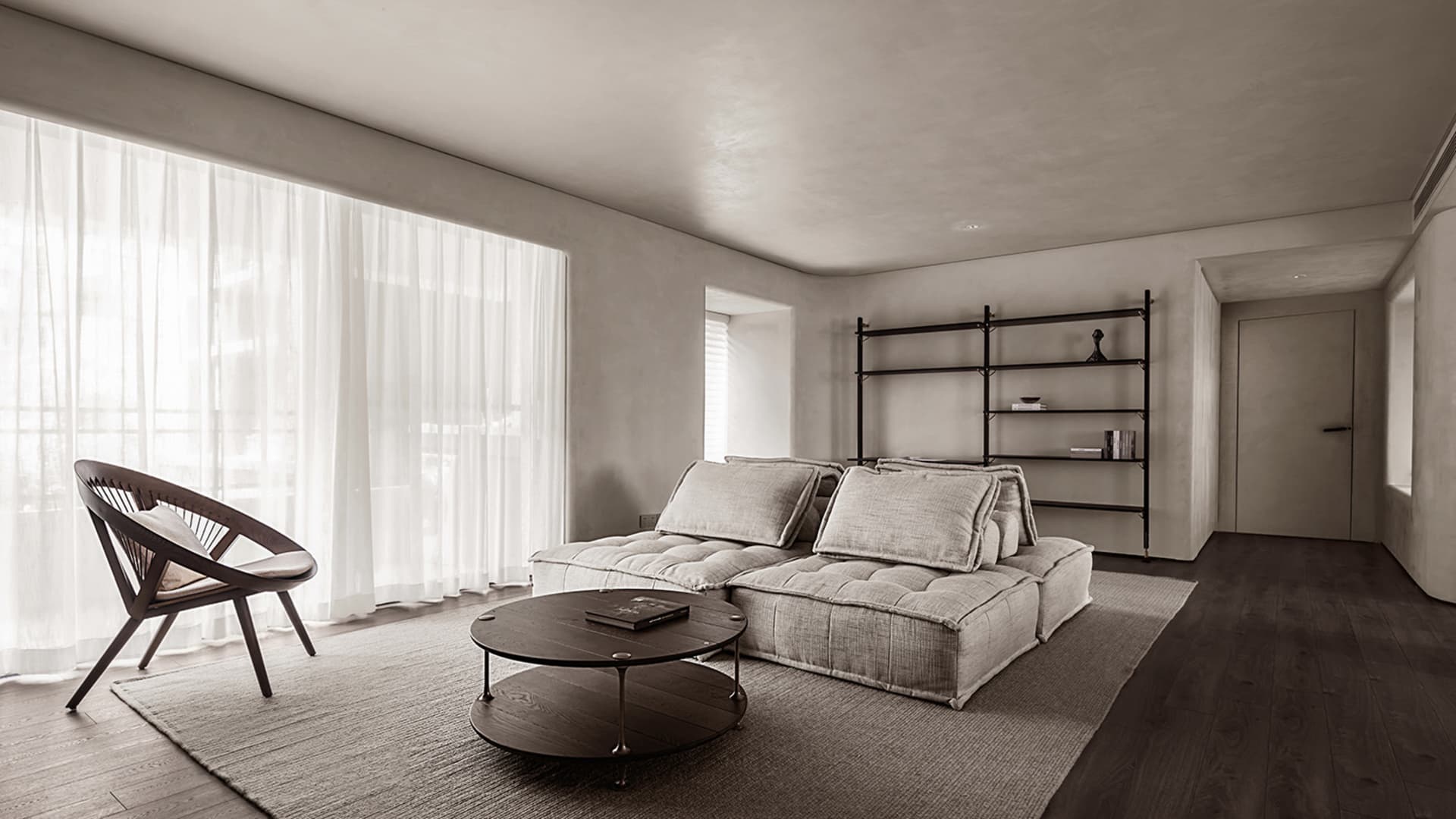 Modern living room with grey furniture, large windows, and a minimalist shelf.