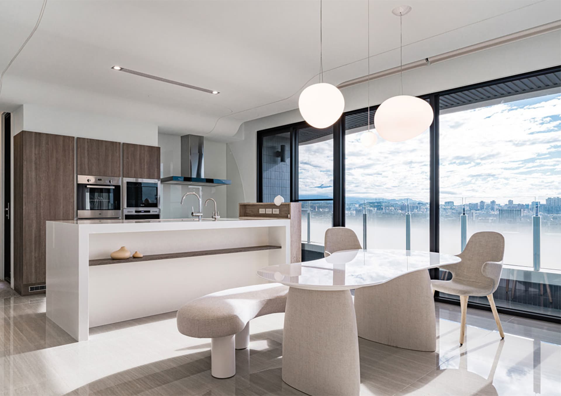 A modern kitchen featuring glass, wood, and white materials.
