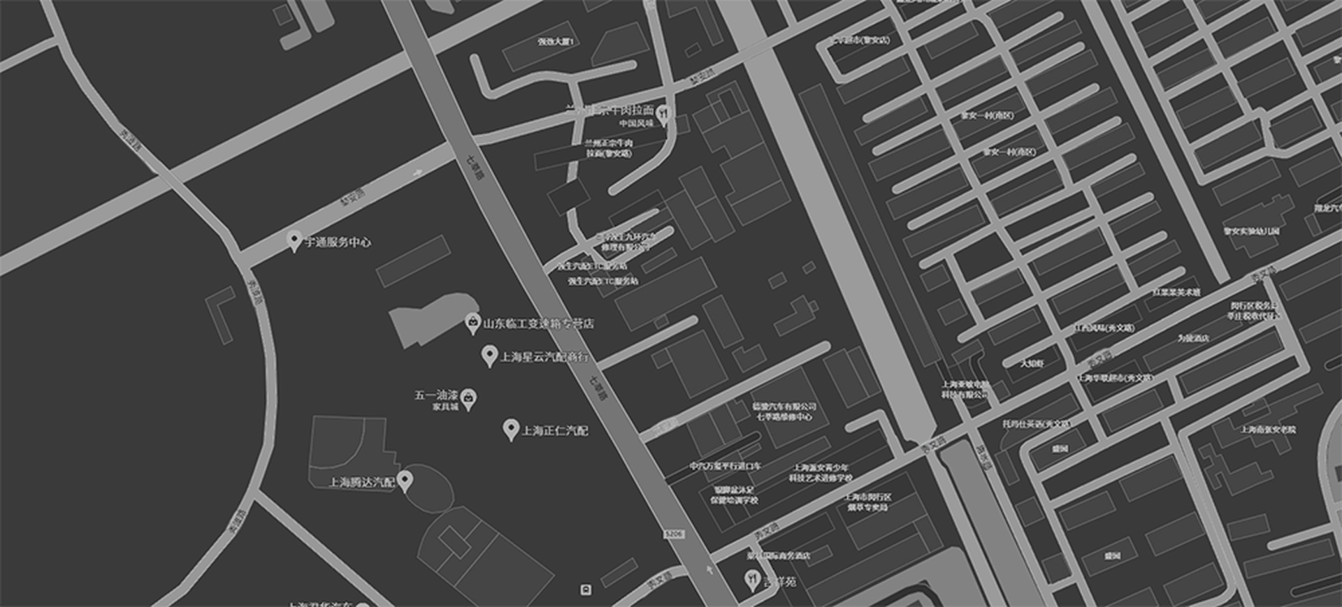 A grayscale map of a city's street layout and landmarks.