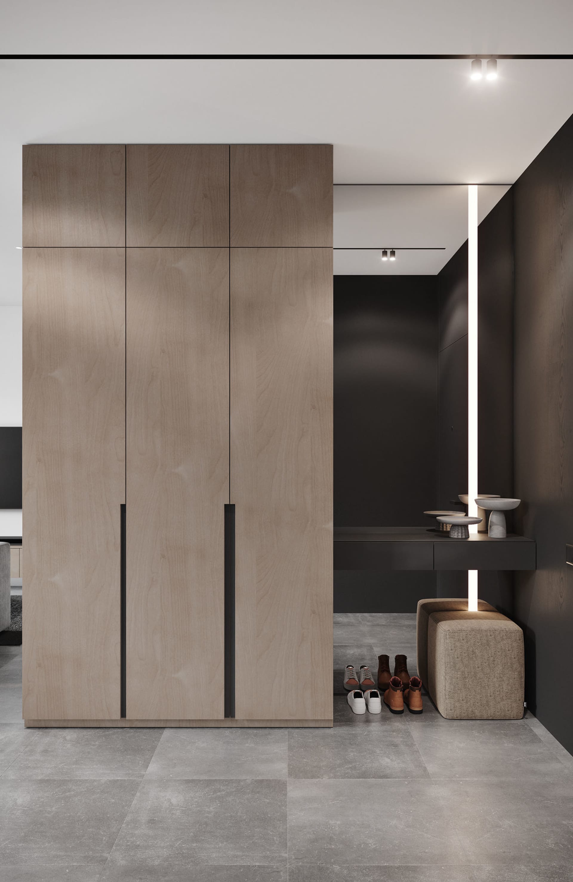 Modern interior design featuring a tall wooden closet with a minimalist design and integrated lighting.