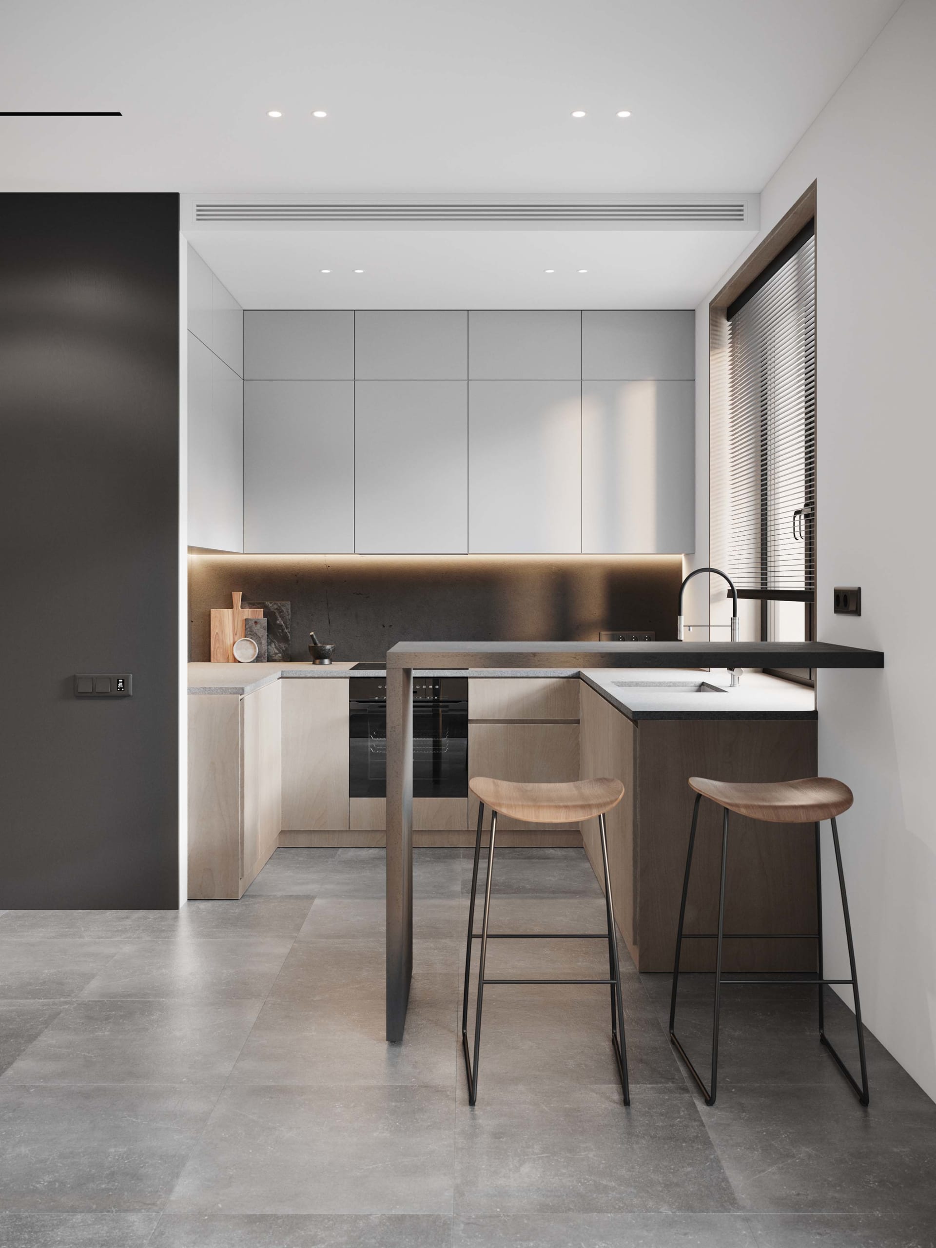 A minimalist residential kitchen featuring concrete countertops and bar stools.