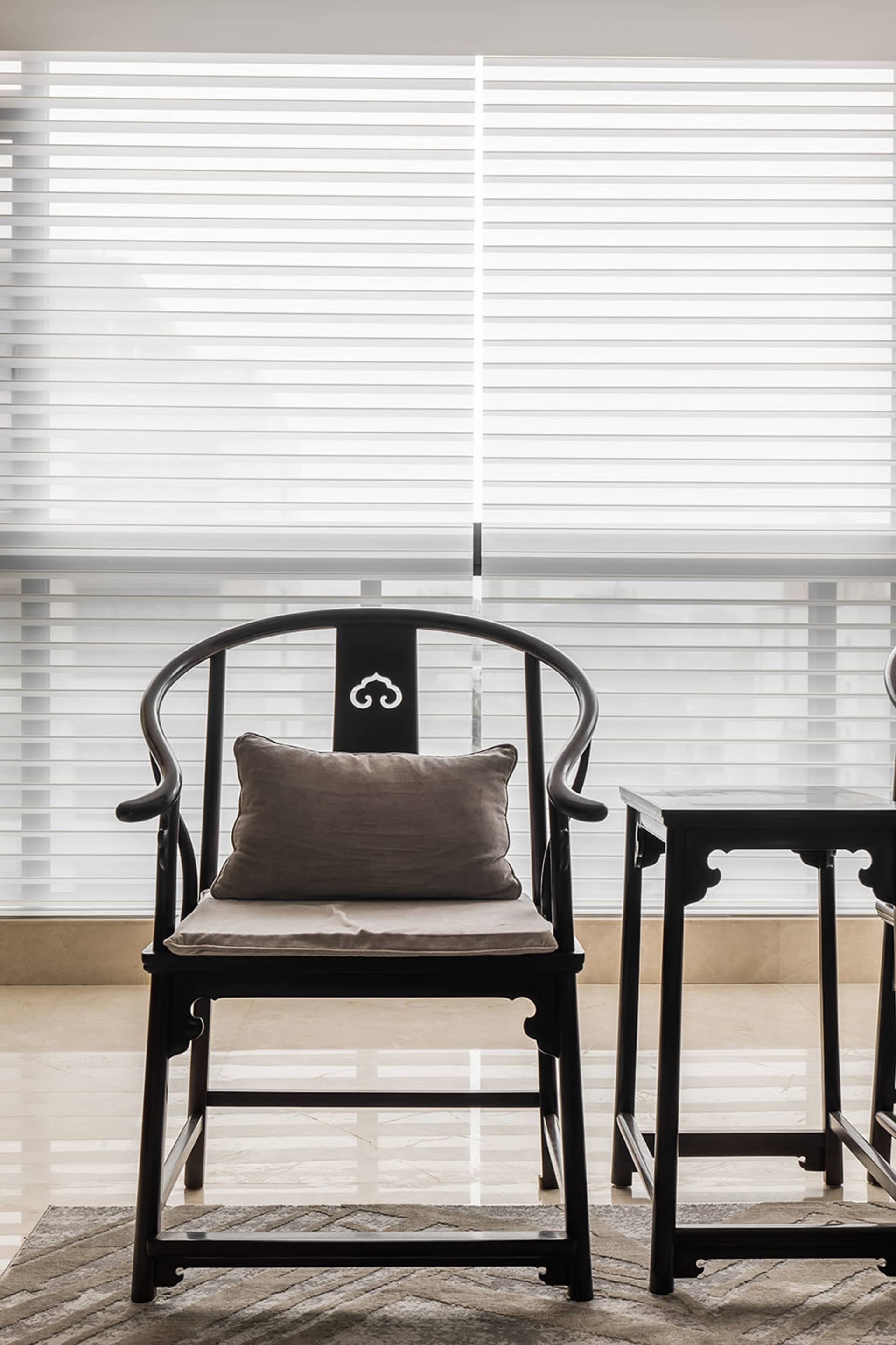 A modern black wooden console table with a minimalist design, featuring sleek lines and a simple, elegant aesthetic.