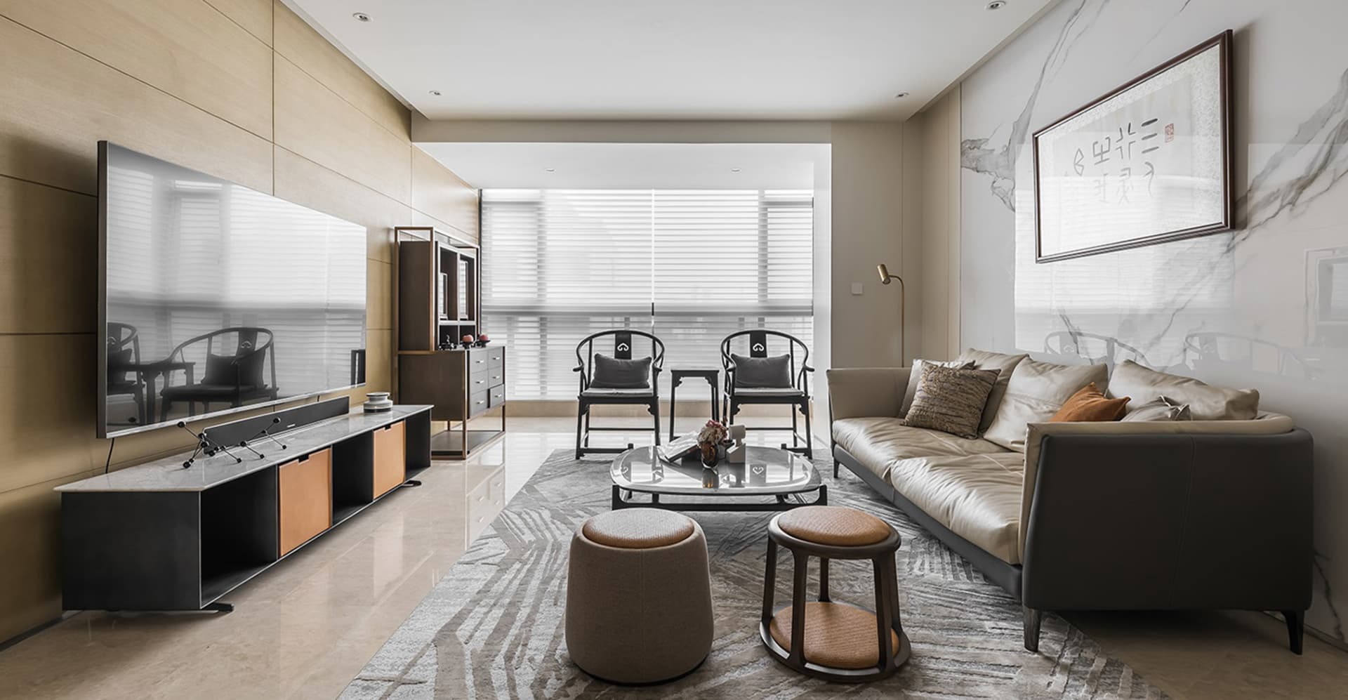 Modern living room with marble accents, leather sofa, and wooden furniture.