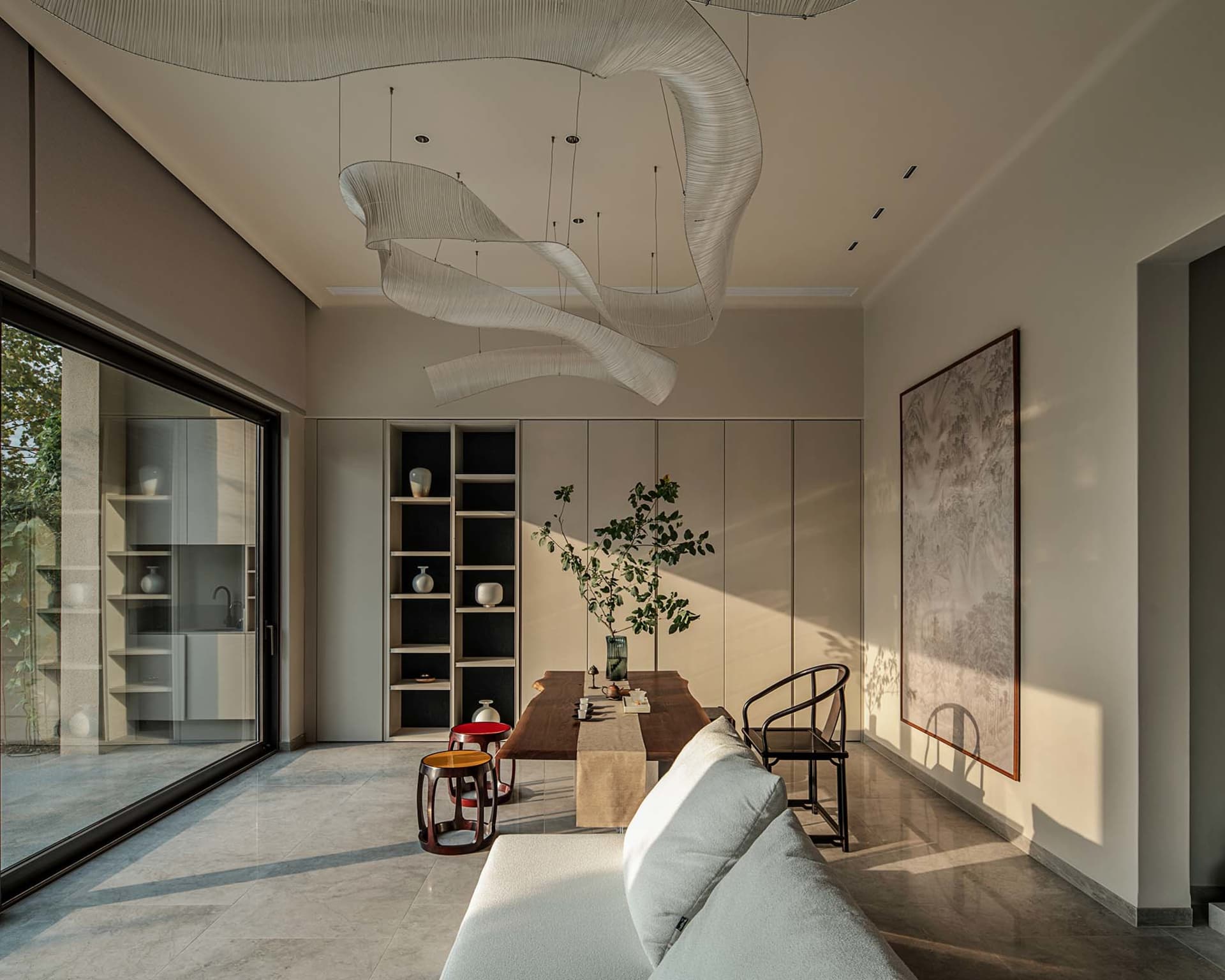 Minimalist living room featuring natural wood and marble materials.