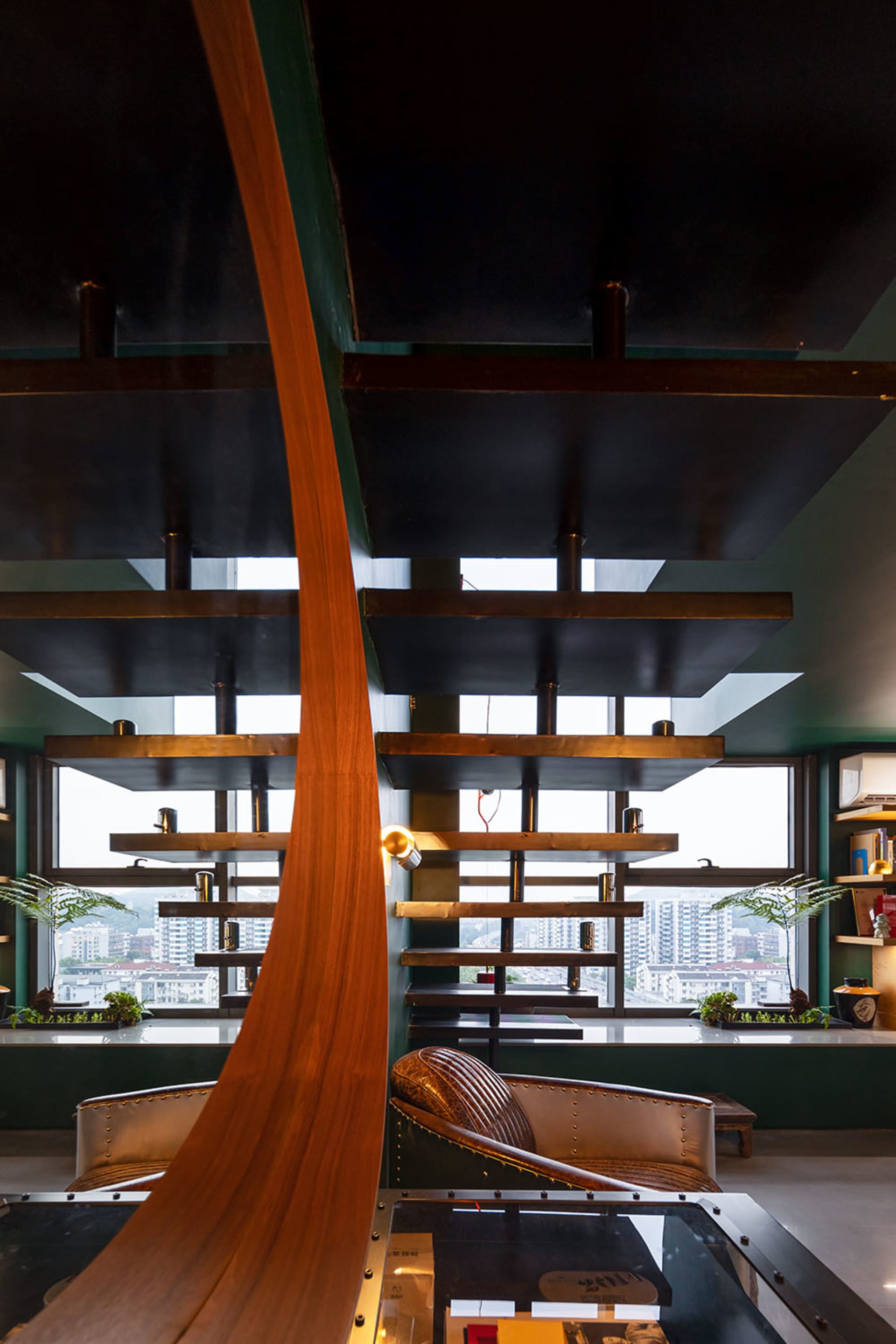 Modern, industrial-style cafe interior featuring wooden and concrete materials.