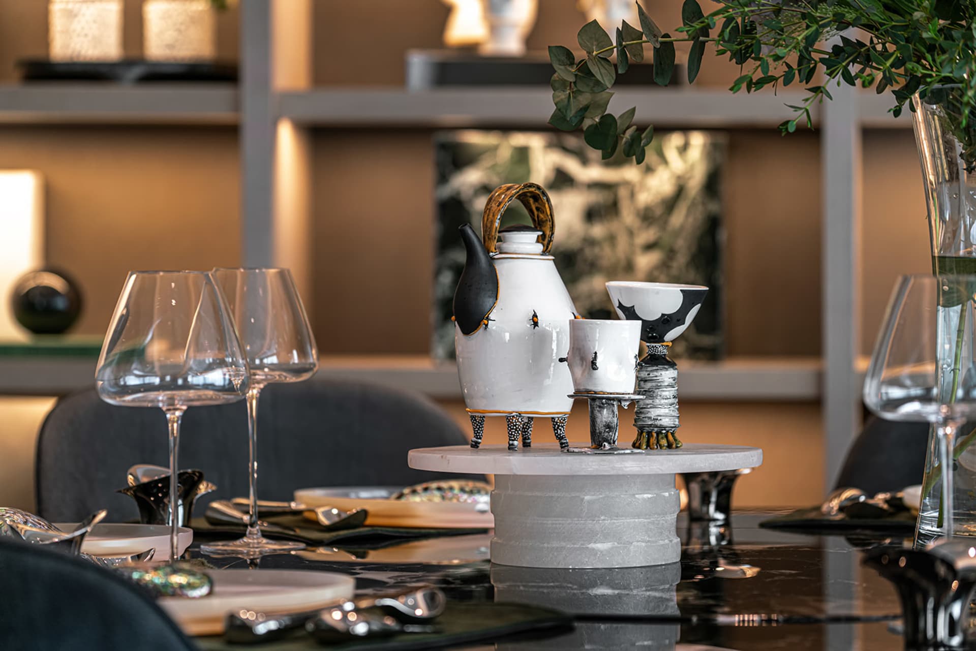A modern, industrial setting featuring ceramic objects on a table.