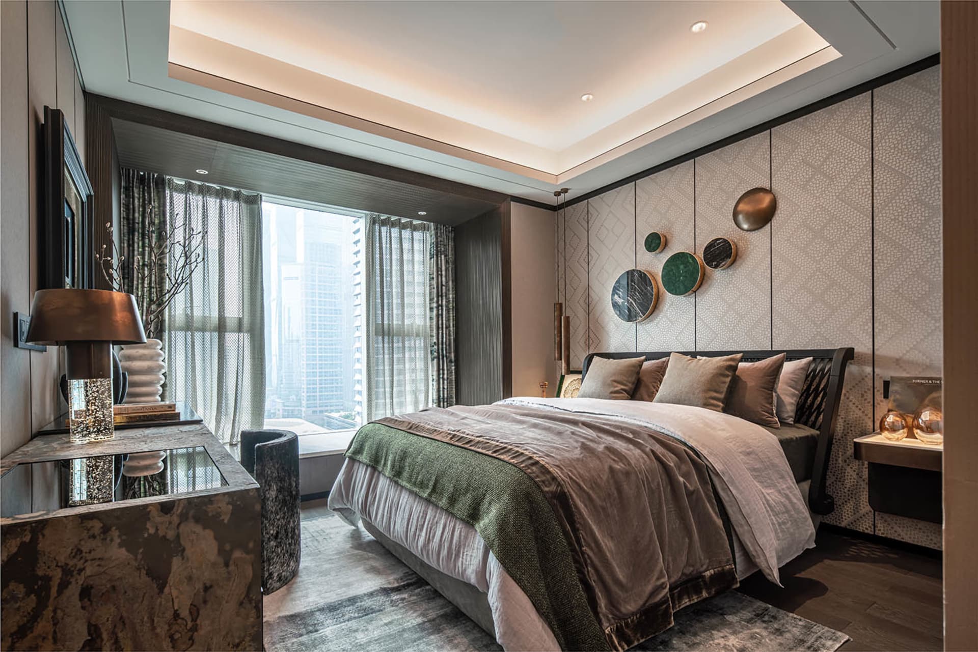 Modern bedroom featuring marble accents and green decorative elements.