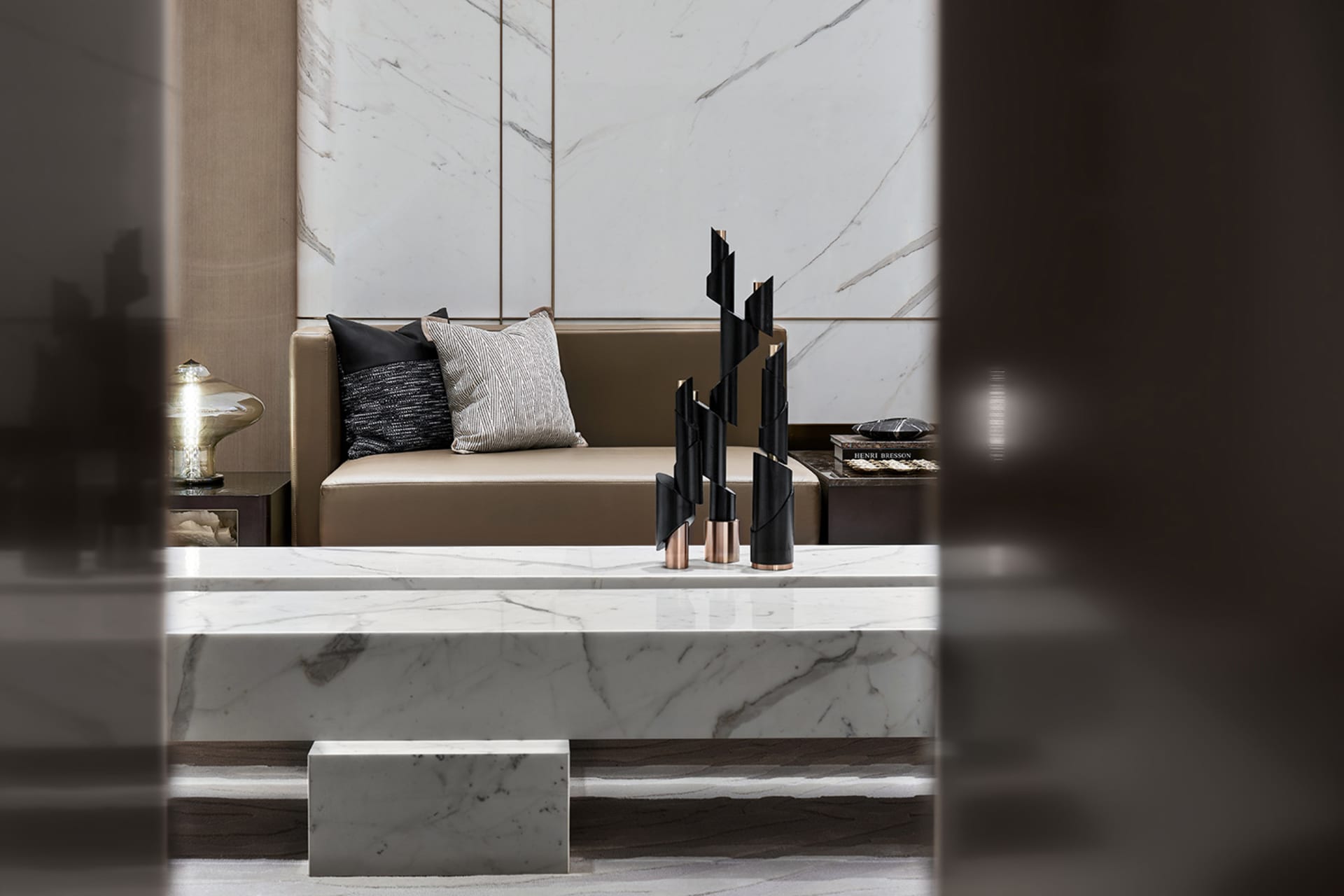 A modern living room featuring marble elements and contemporary decor.