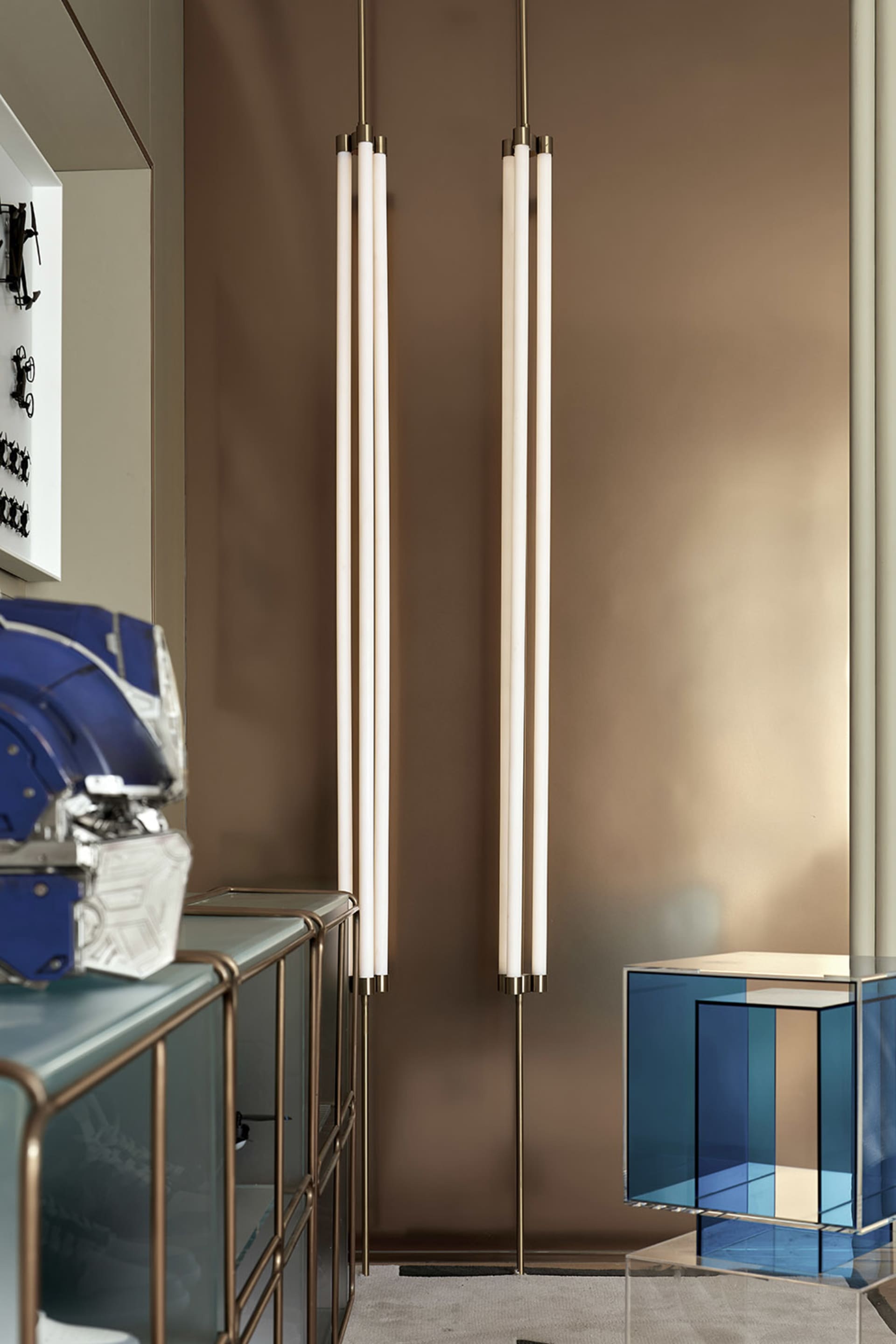 A minimalist living room featuring metallic accents and modern design elements.