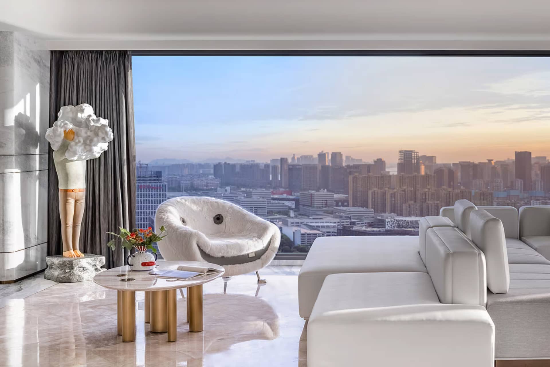 A modern minimalist living room with city view from a high-rise apartment