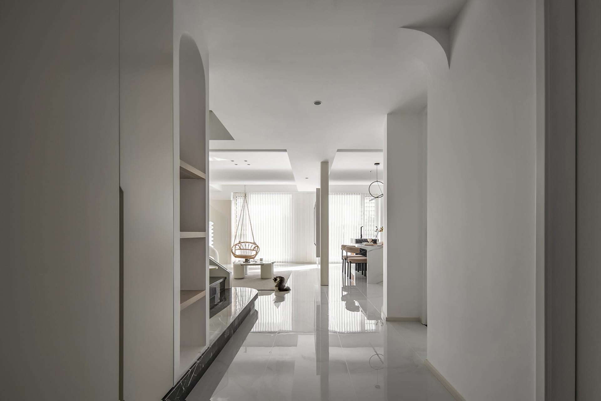 A contemporary living room with white marble flooring, minimalist decor, and a modern lamp.