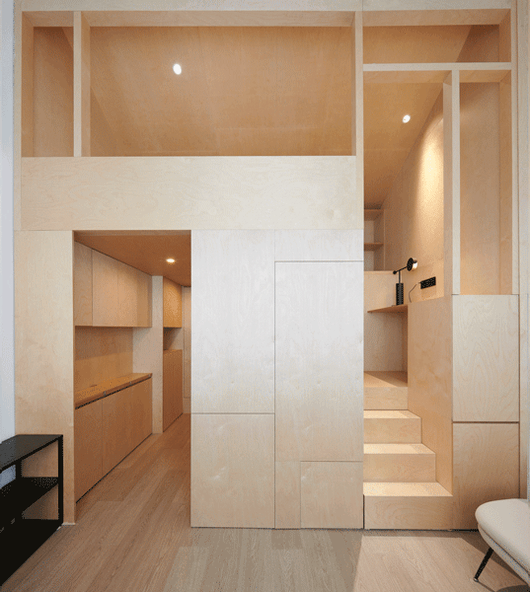 A modern apartment interior featuring light-colored wood