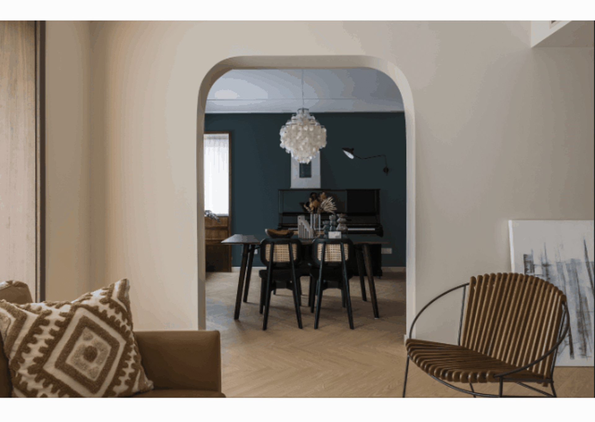 Interior design featuring modern living room with wooden floor, fabric furniture, and metal accents.