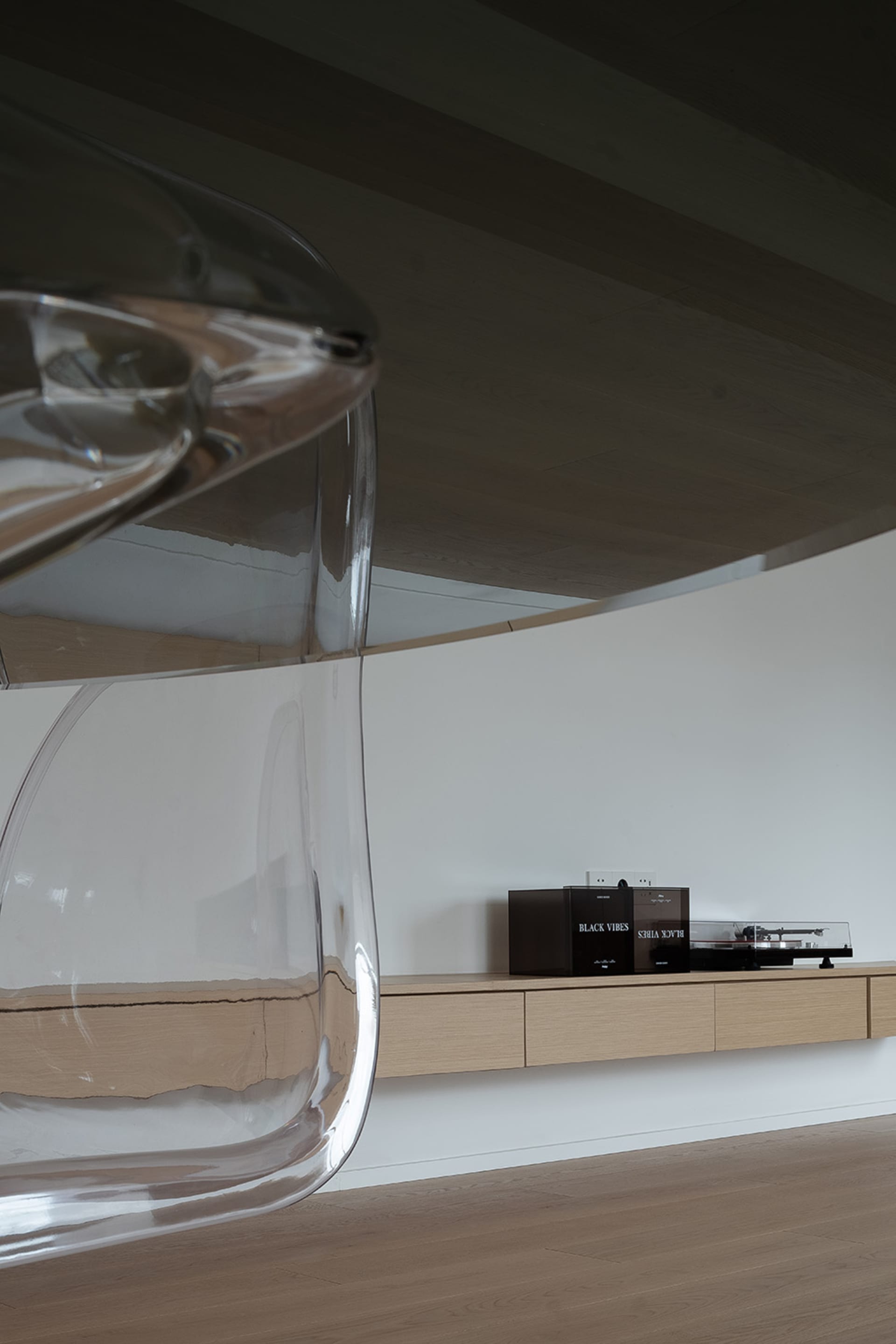 A well-designed living room featuring modern furniture made of glass with sleek lines and minimalist design.