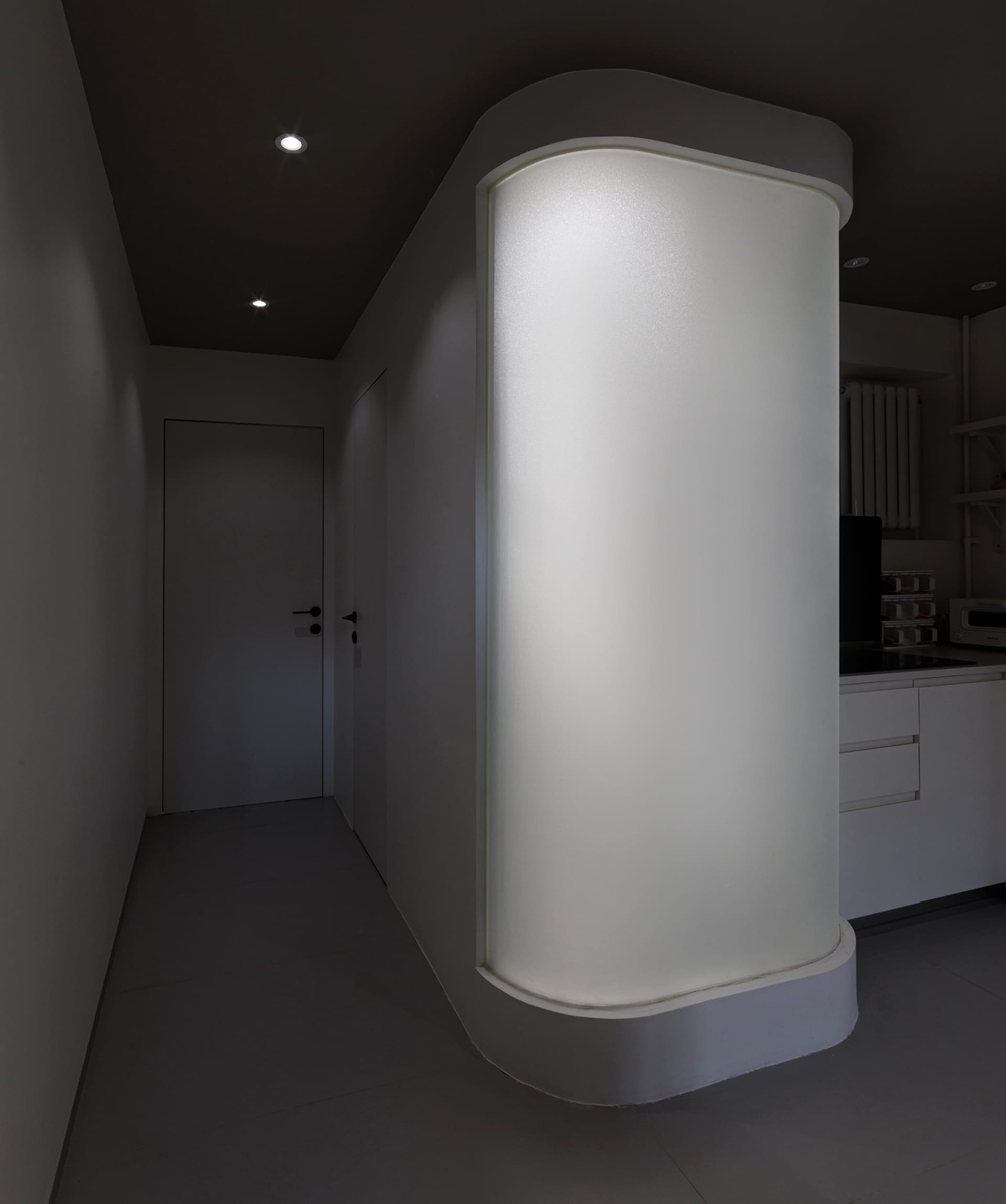 Modern residential interior with minimalist design and concrete and glass materials