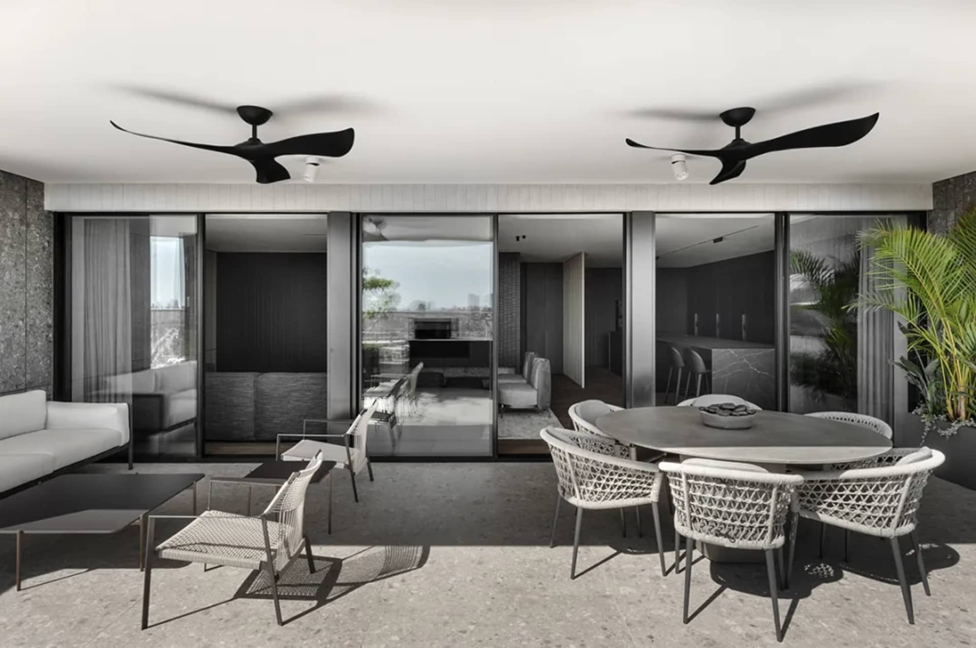 Modern living room with concrete, glass, and metal accents.