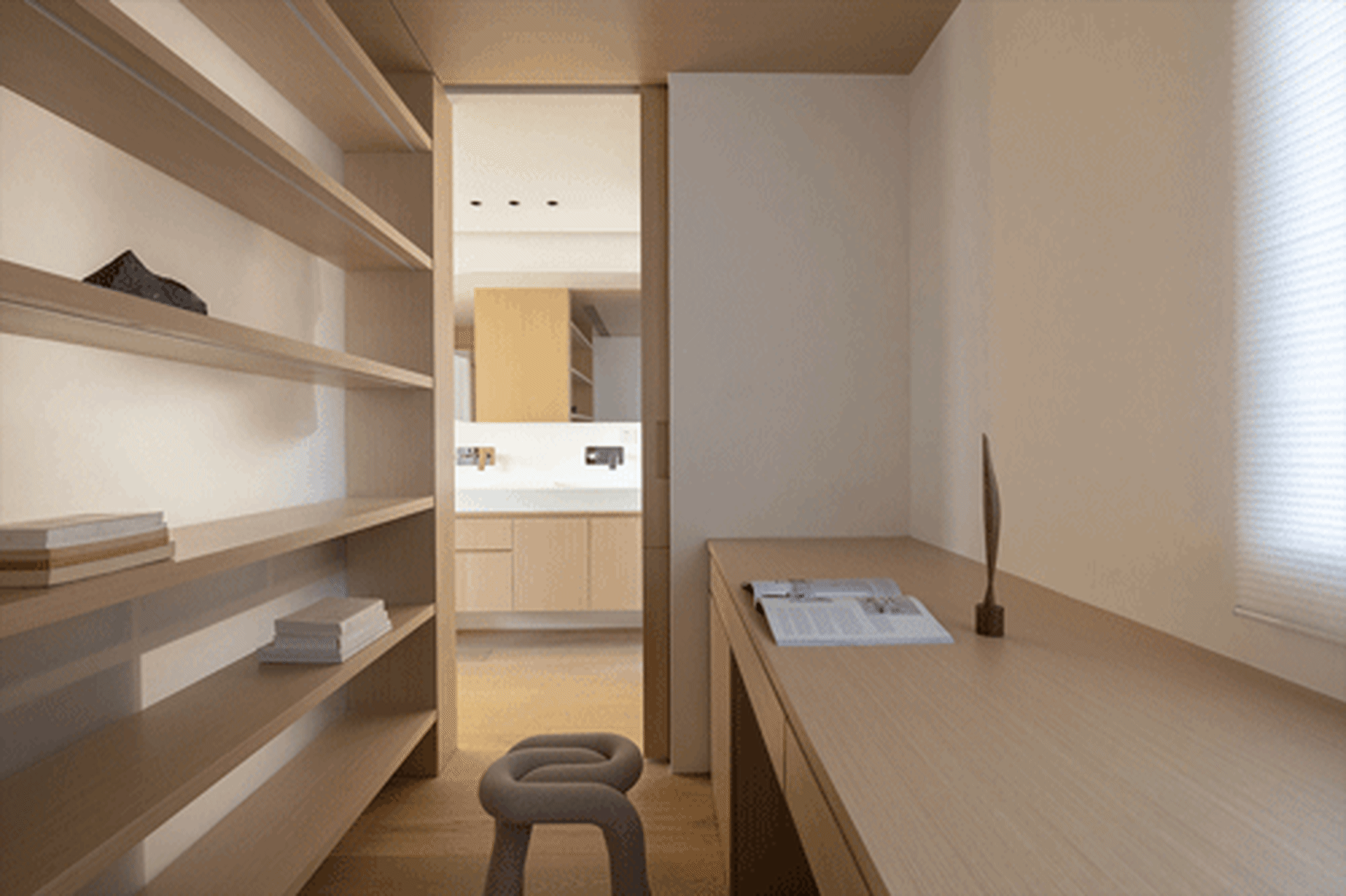 A minimalist workspace featuring a wooden desk and shelf.