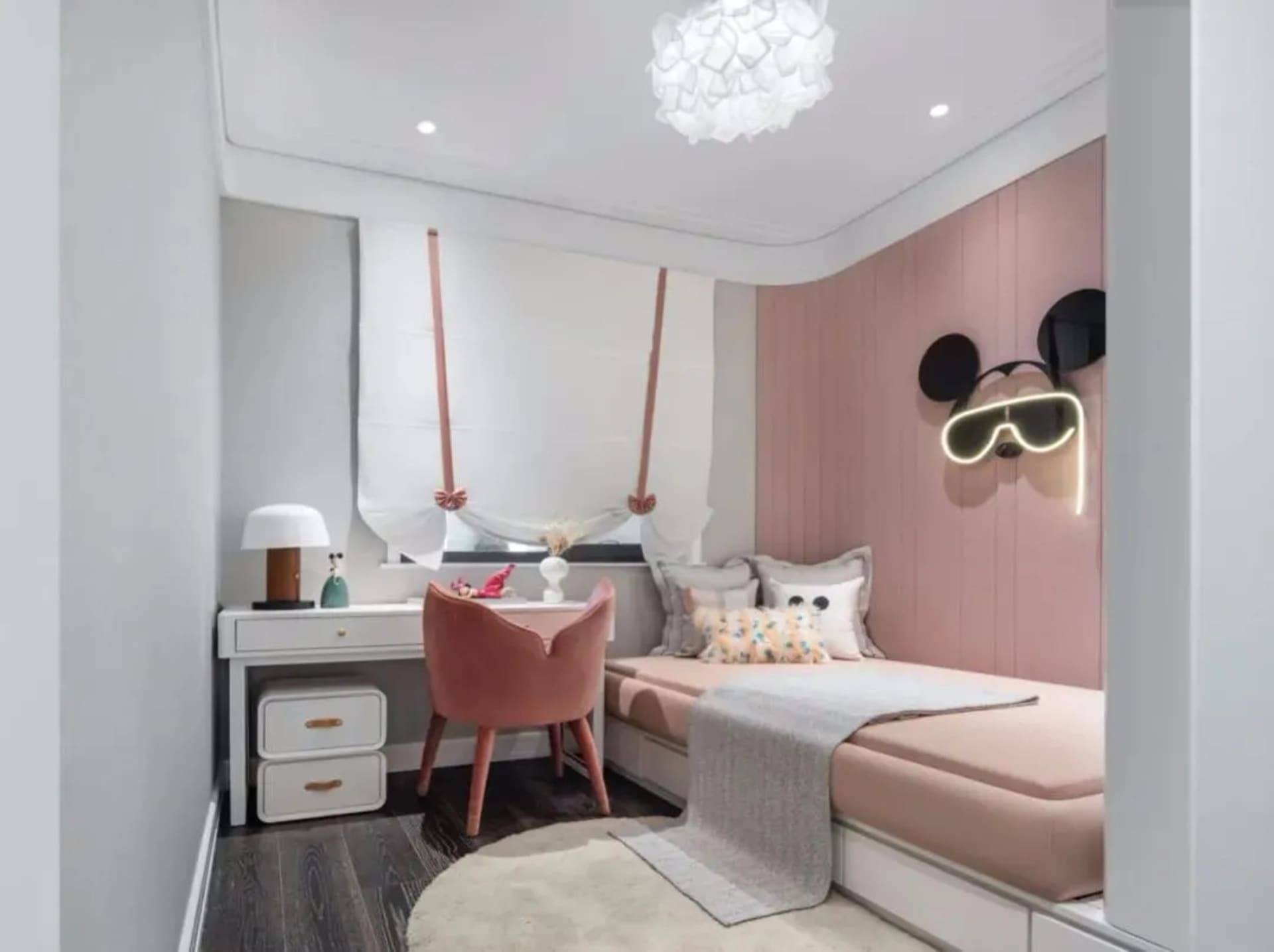 Minimalist bedroom featuring a single bed, wooden floor, fabric curtains, and plaster walls