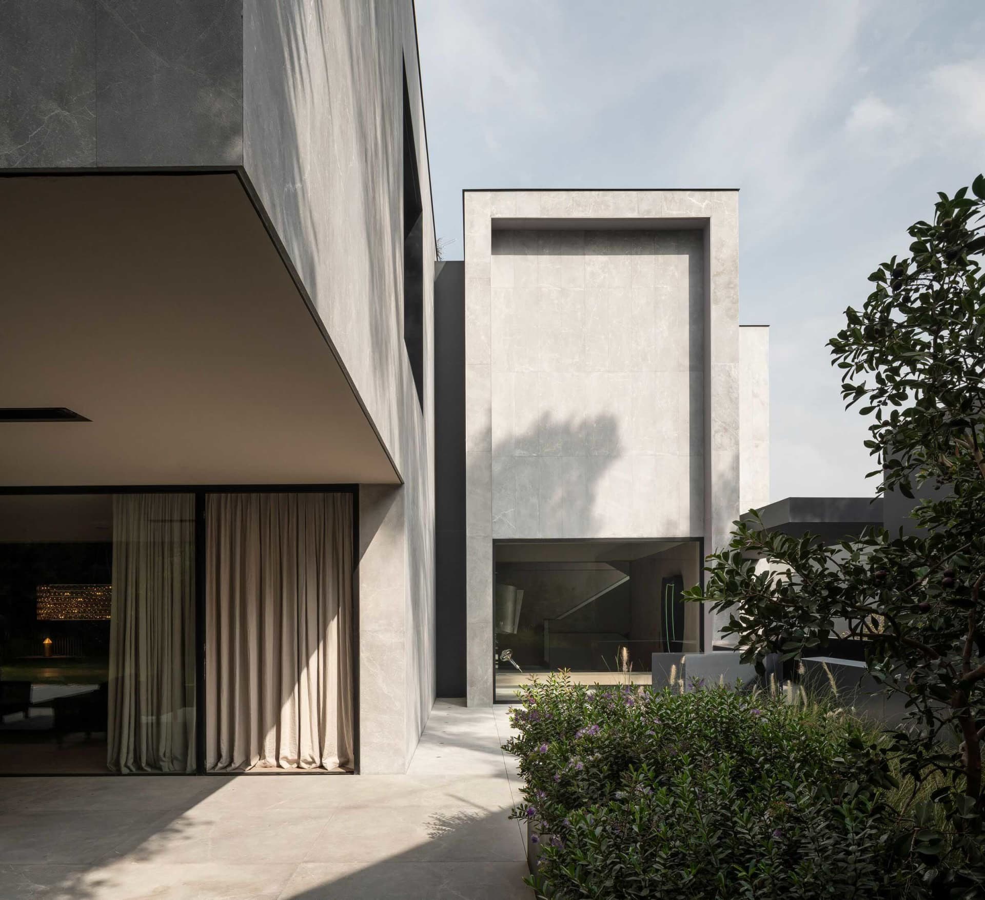 Modern house with concrete exterior and large windows