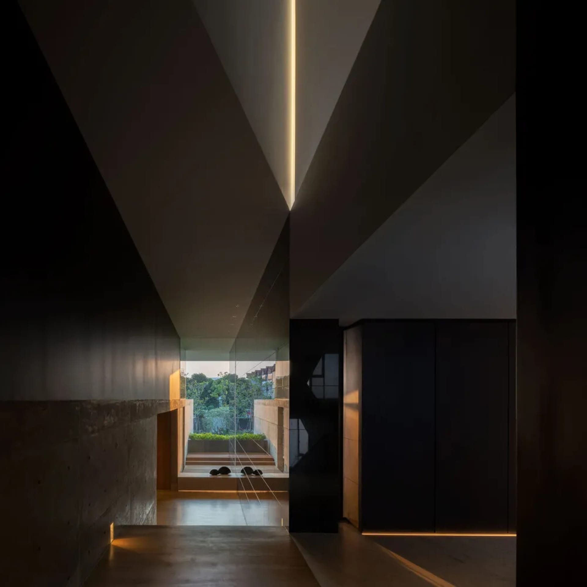 A modern interior space featuring concrete walls and floors.