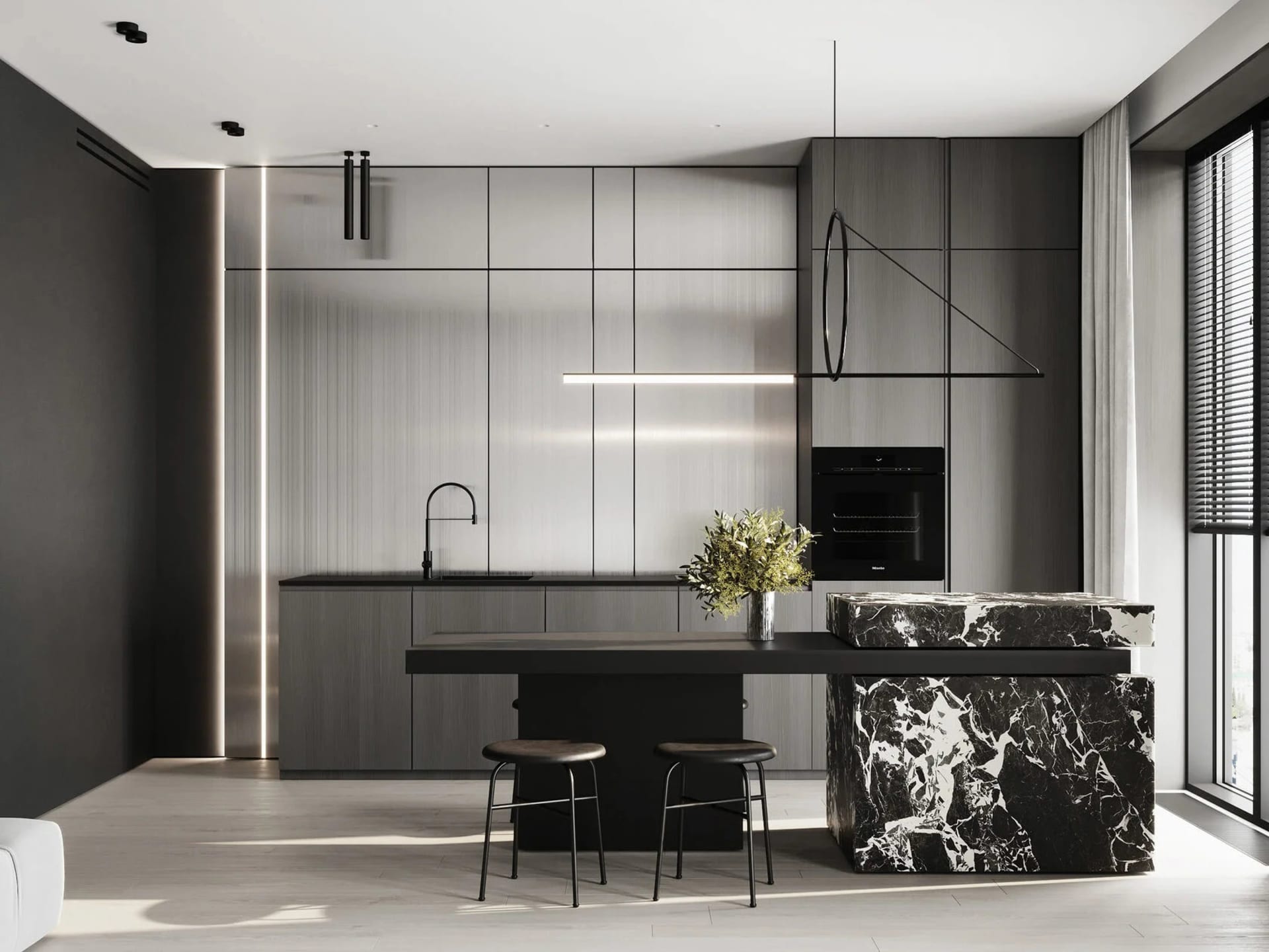 Modern minimalist kitchen featuring a kitchen island with black marble countertops and black stools.