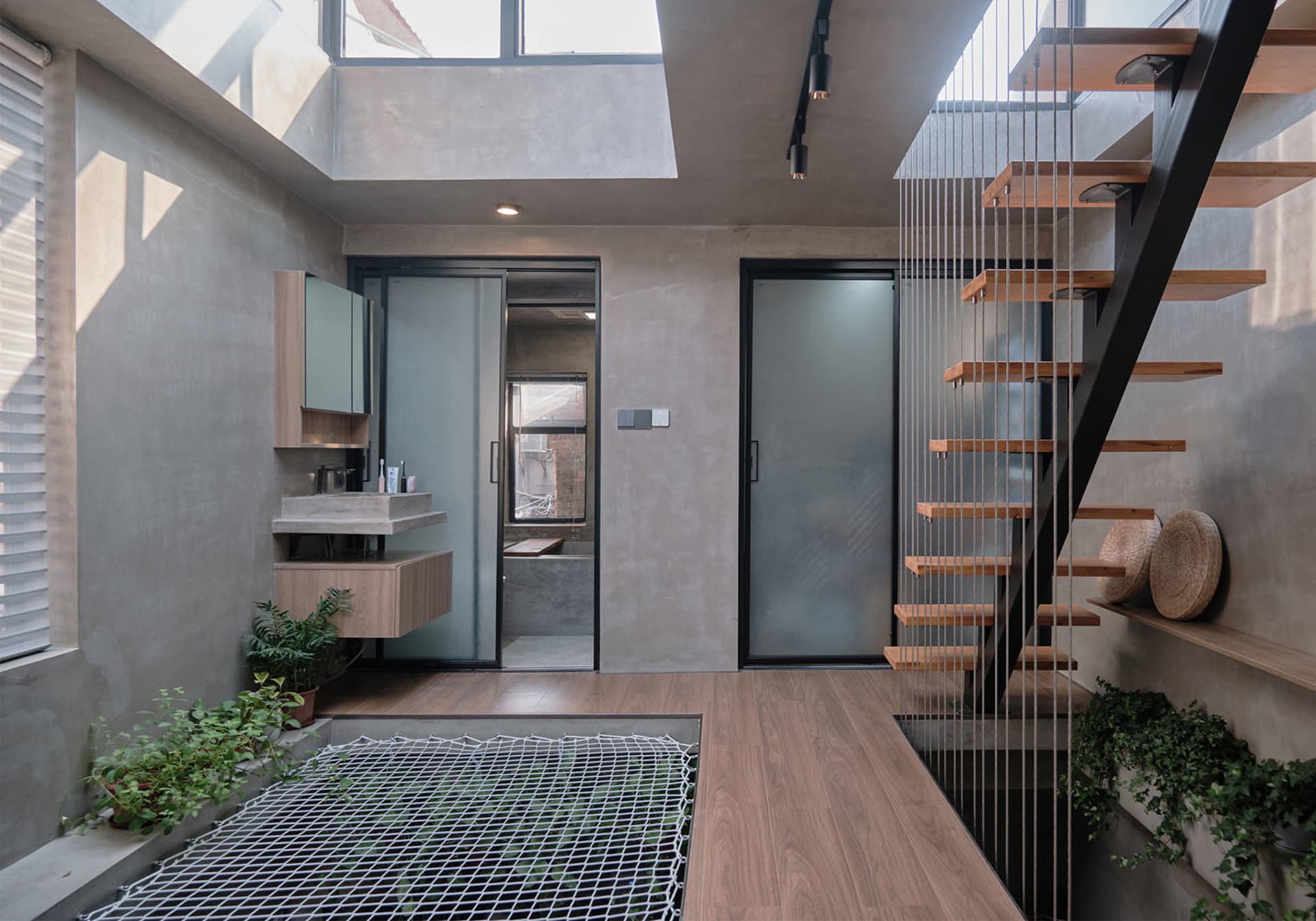 A modern retail storefront featuring concrete walls and floors.