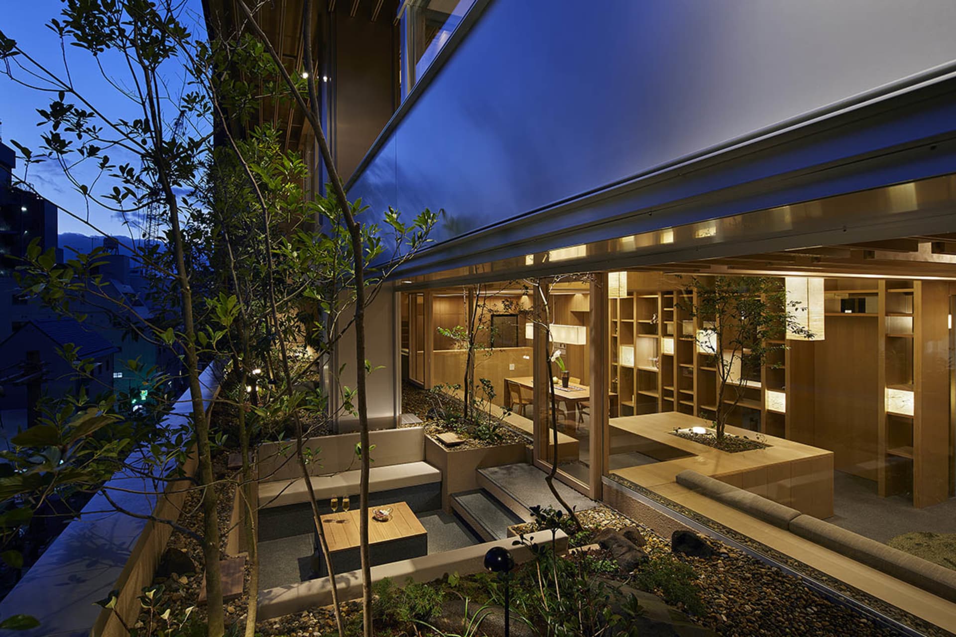 Modern indoor garden space featuring wooden elements and lighting.