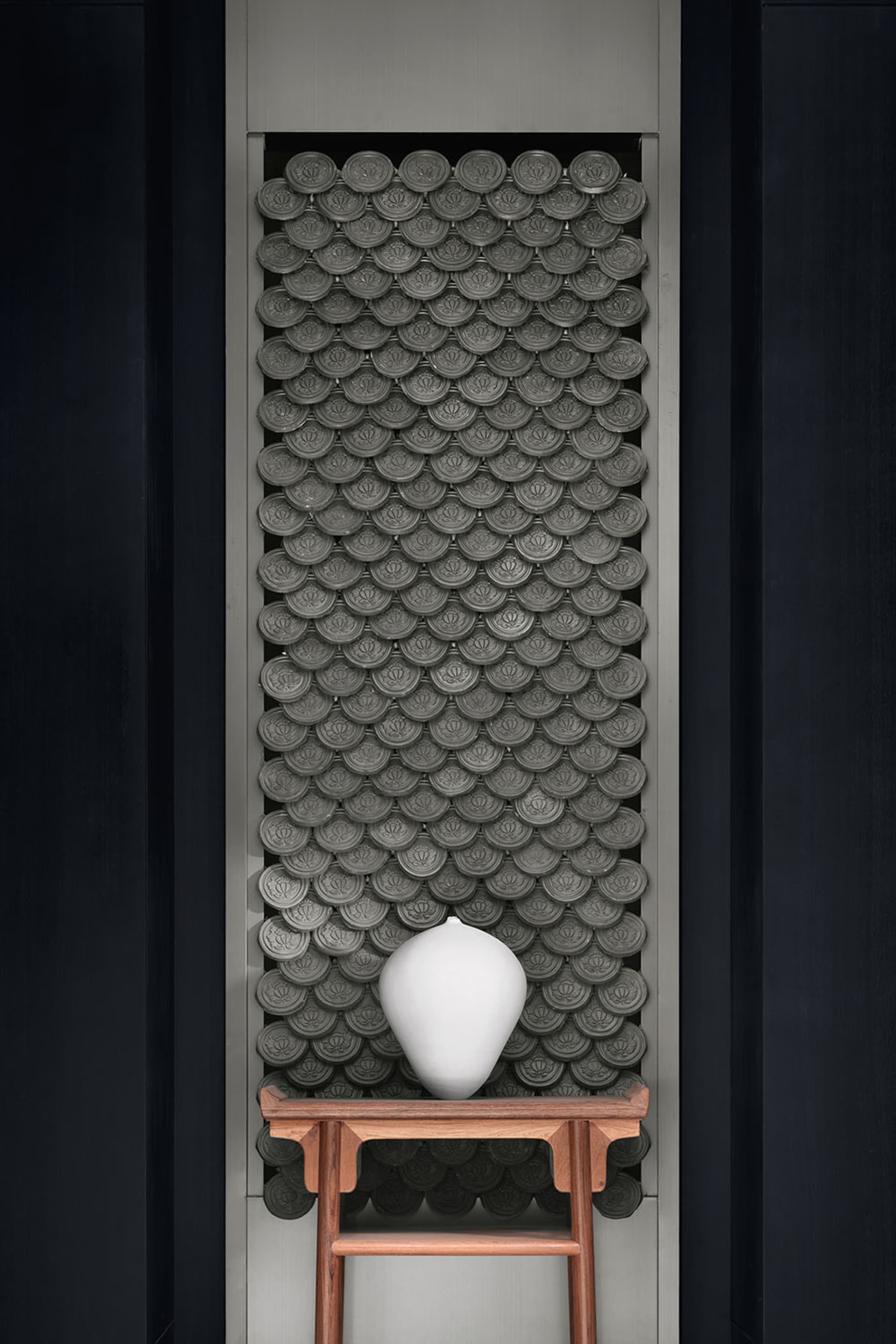 Modern interior design featuring a decorative ceramic tile backdrop