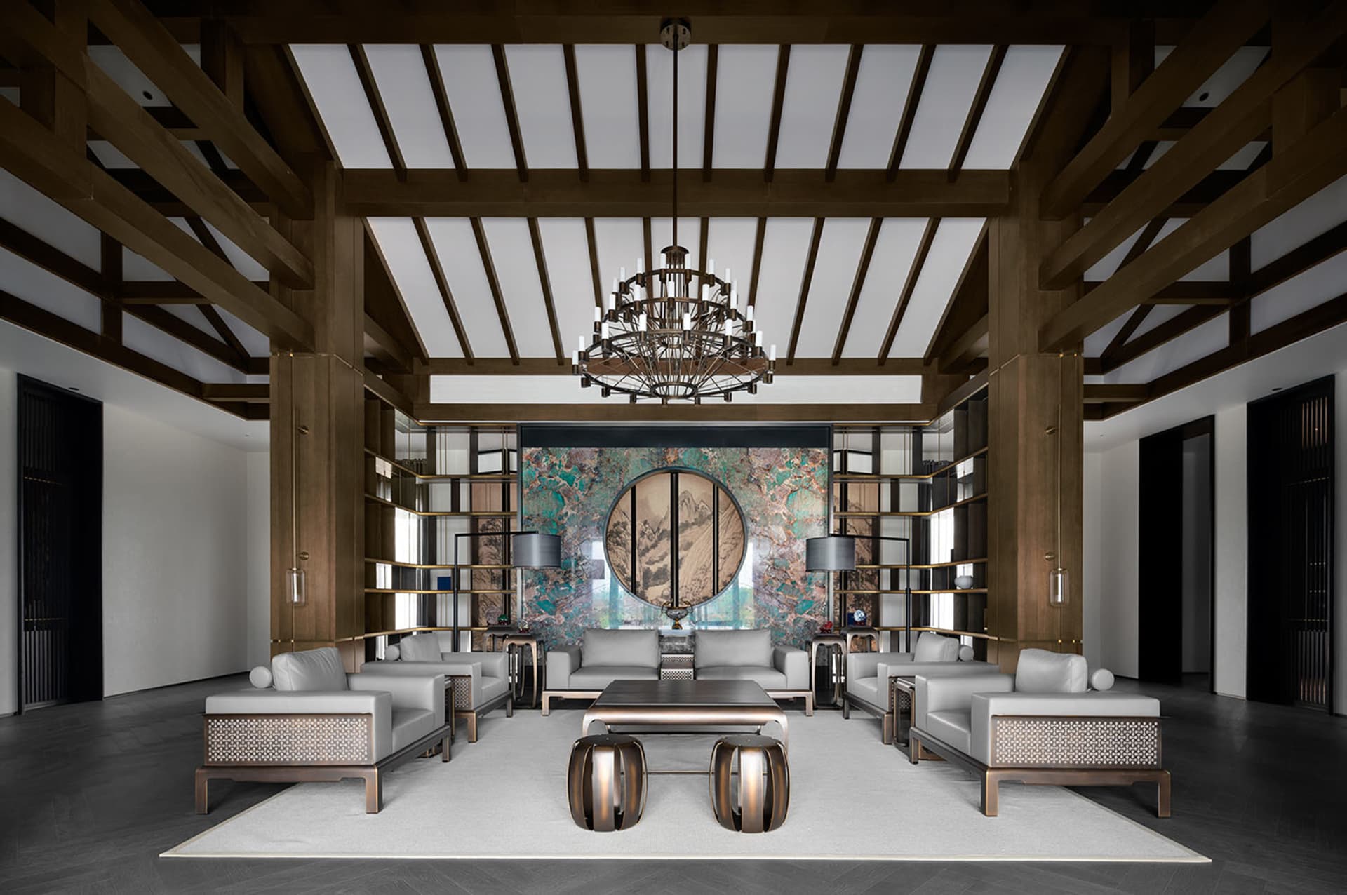 Earthy, modern lounge designed with marble, wood, and metal elements