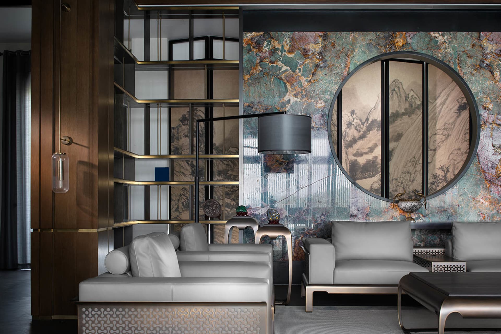 Modern residential interior with marble accents, featuring contemporary furniture and lighting.
