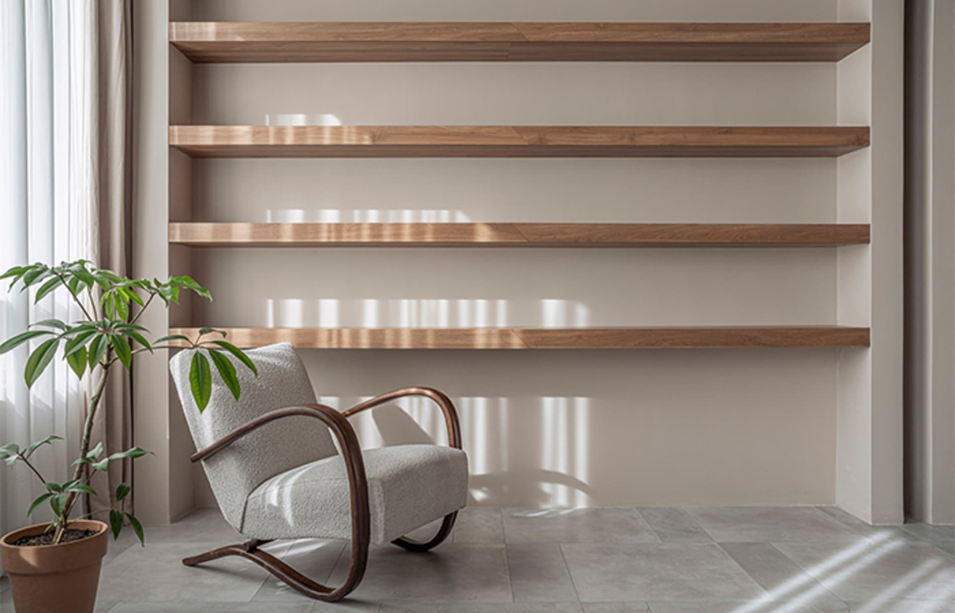 A minimalist living room featuring floating shelves and wooden furniture.