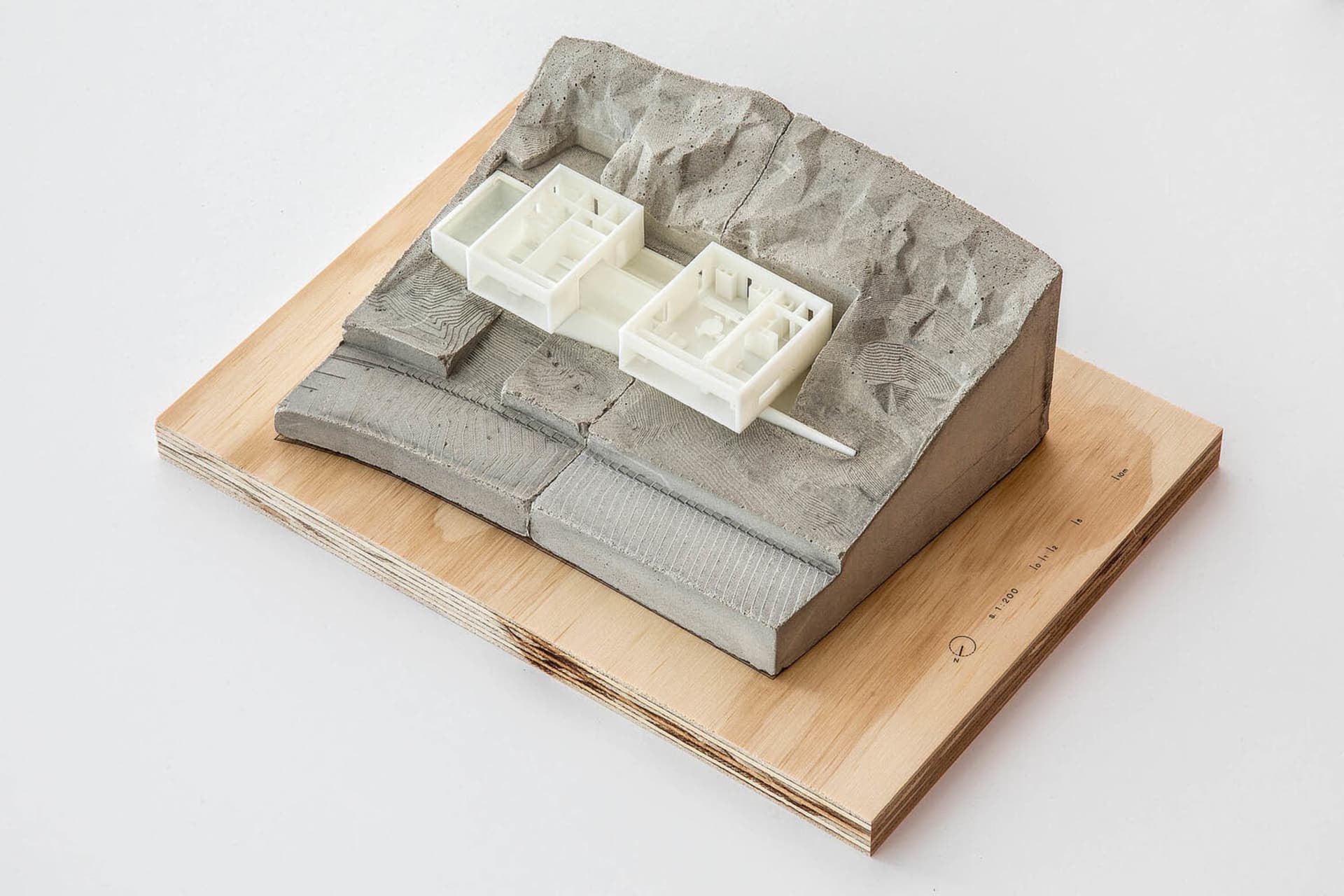 A model of a modern architectural design made of concrete.