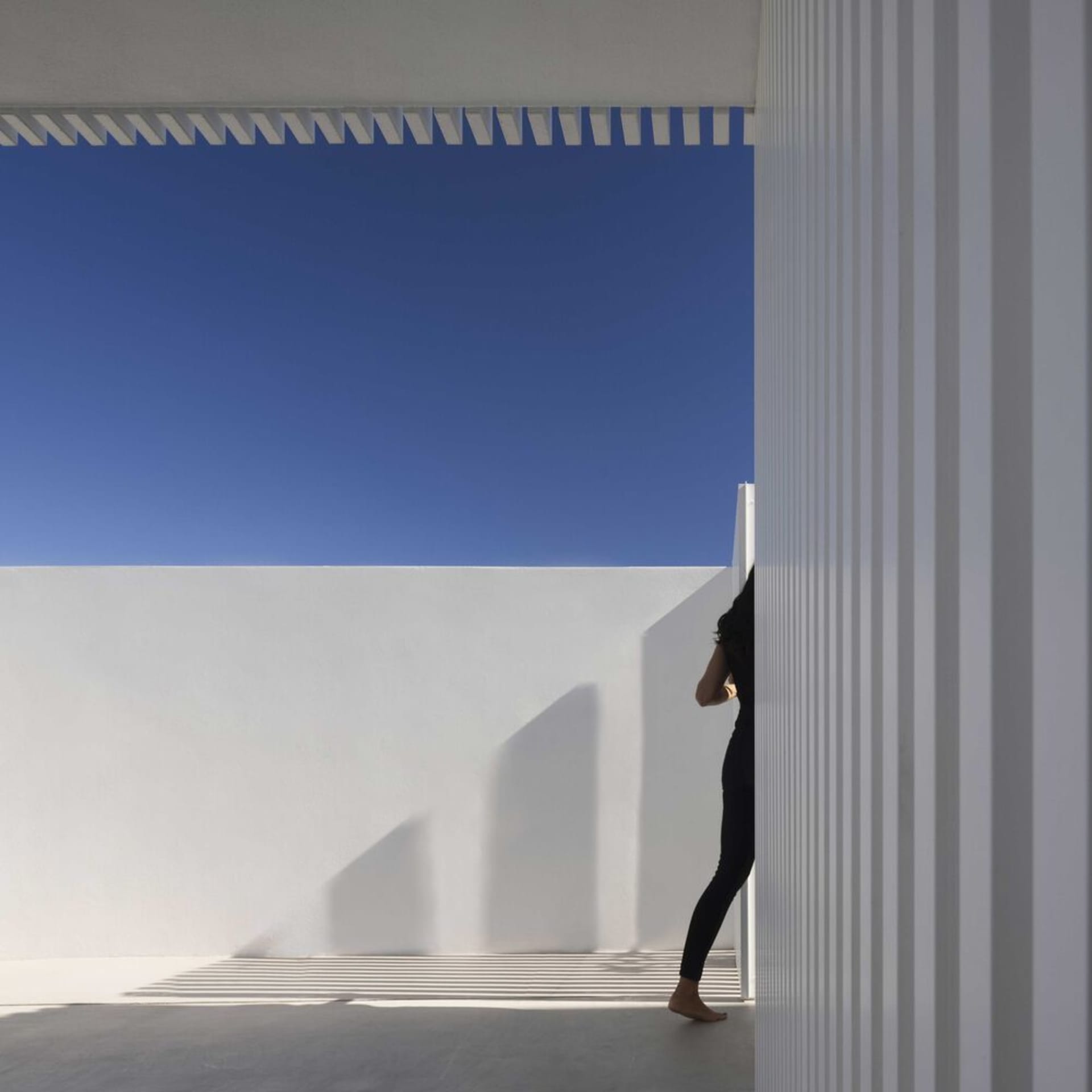 A minimalist terrace made of concrete.