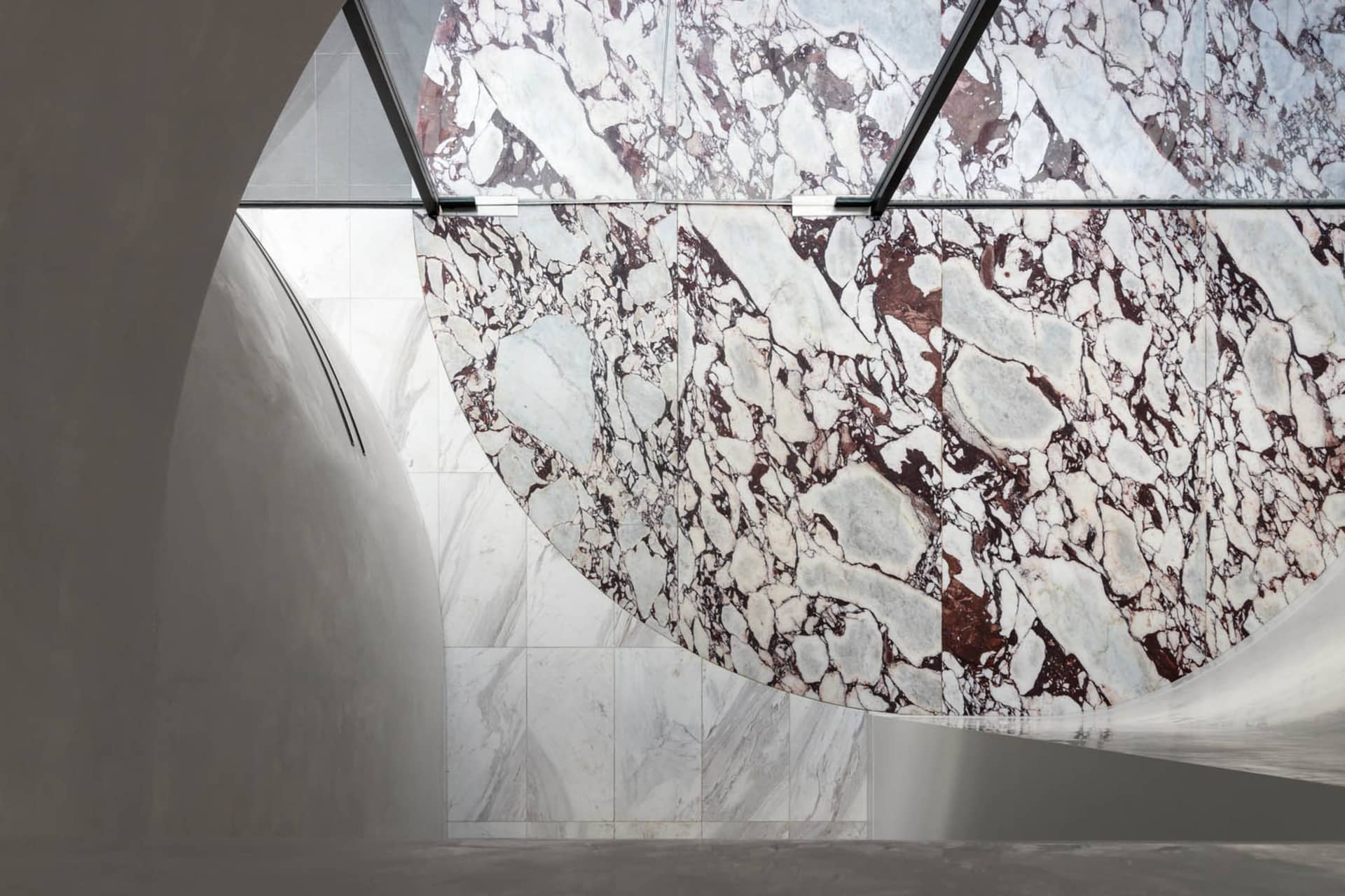 Modern interior space featuring marble walls and flooring