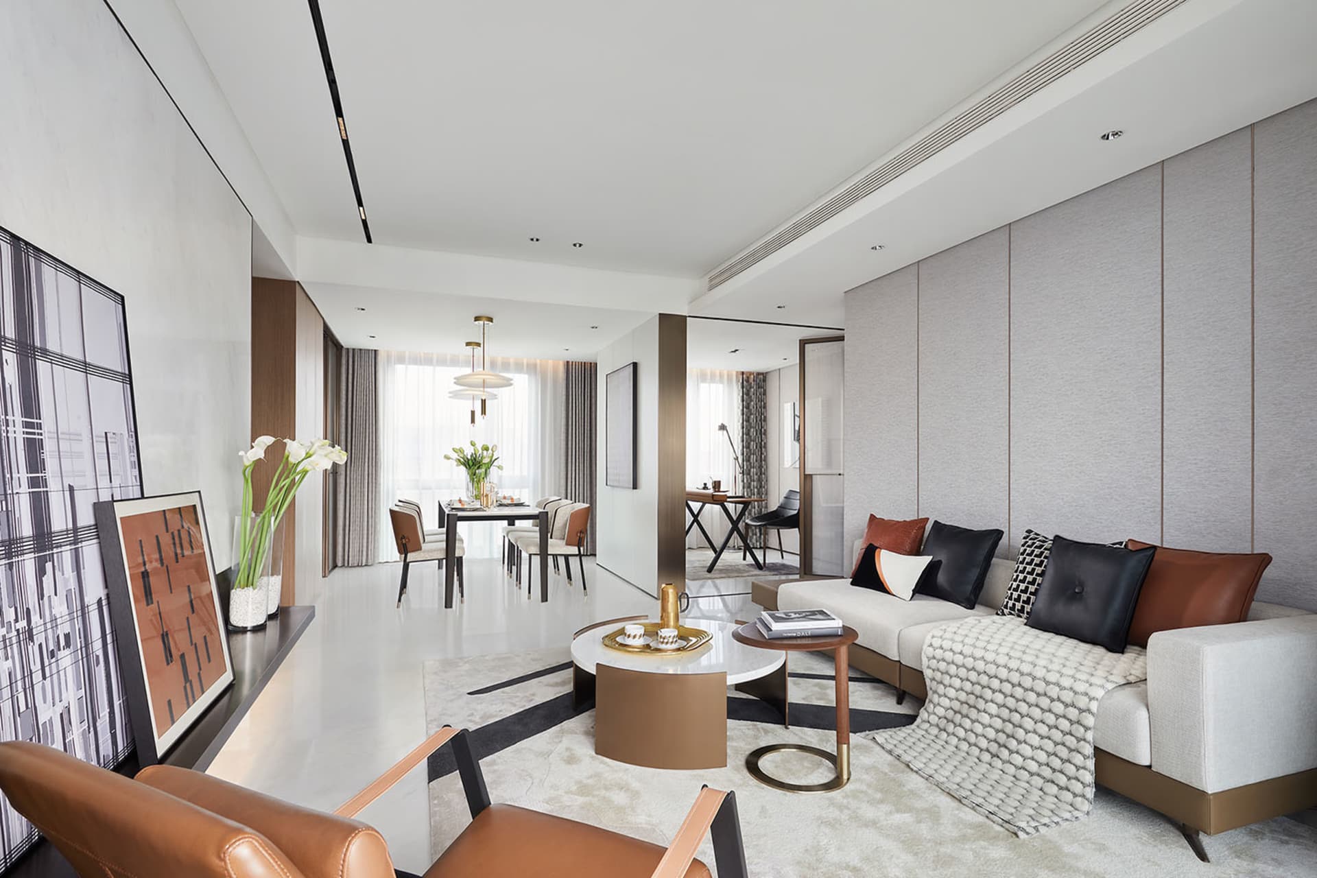 Modern living room featuring leather, fabric, and metal materials.