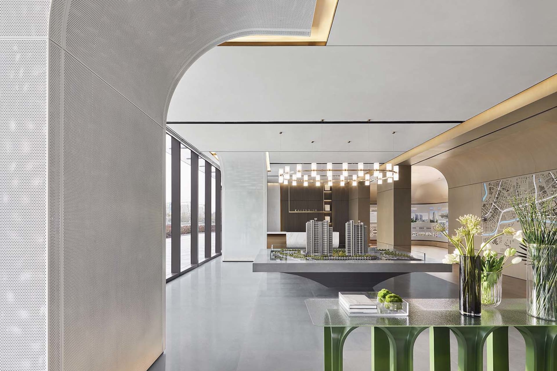 An interior design image of a modern office space featuring clean, minimalist design with concrete finishes and integrated LE