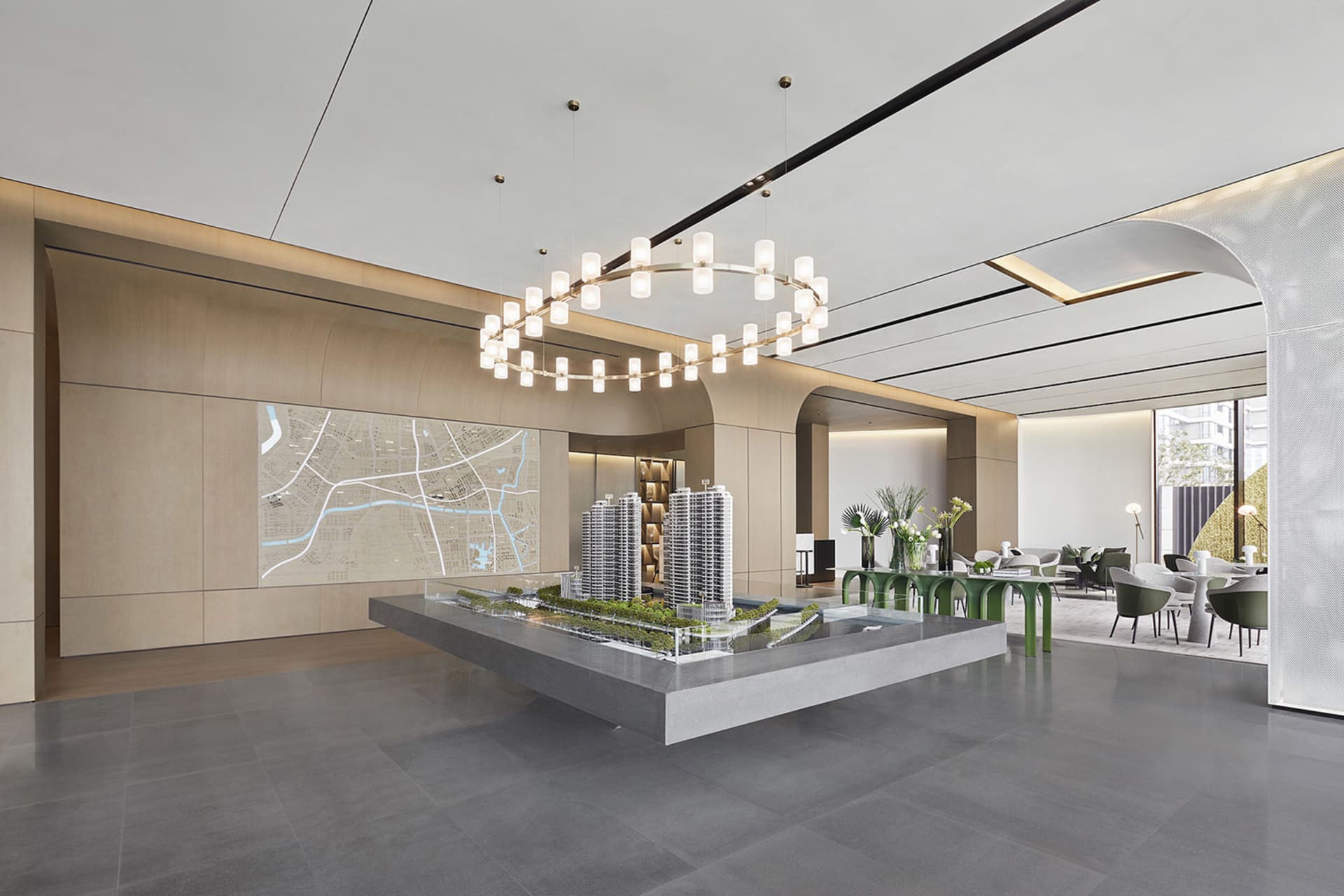 A modern lobby interior with a concrete architectural model.