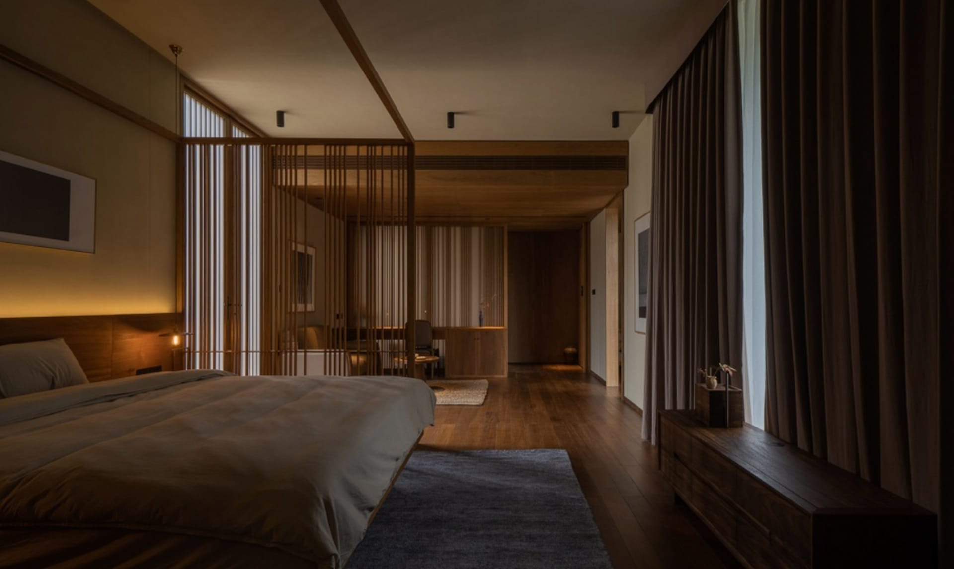 A modern bedroom featuring wooden furniture.