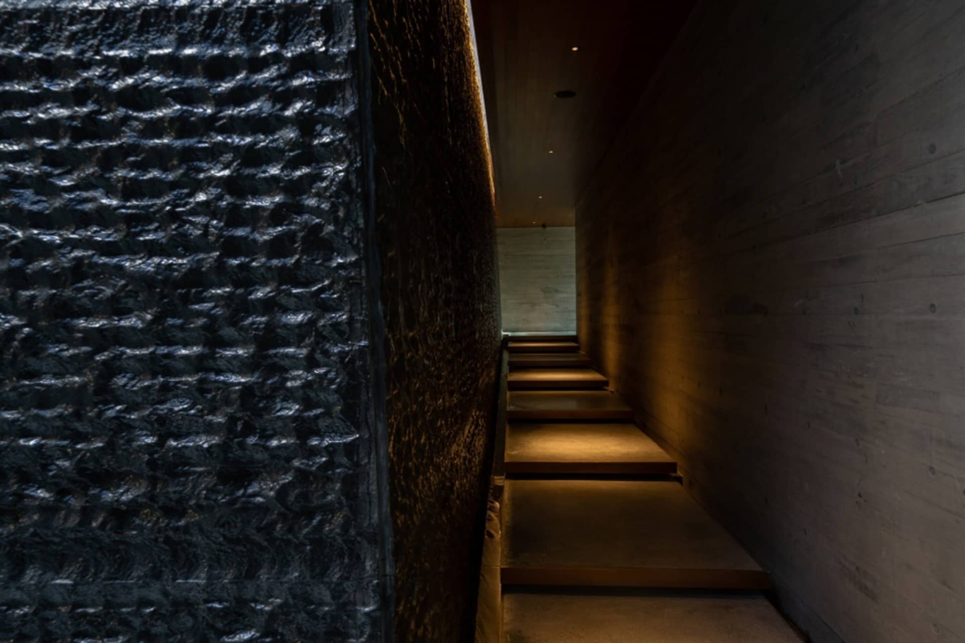 Minimalist indoor staircase made of polished concrete.