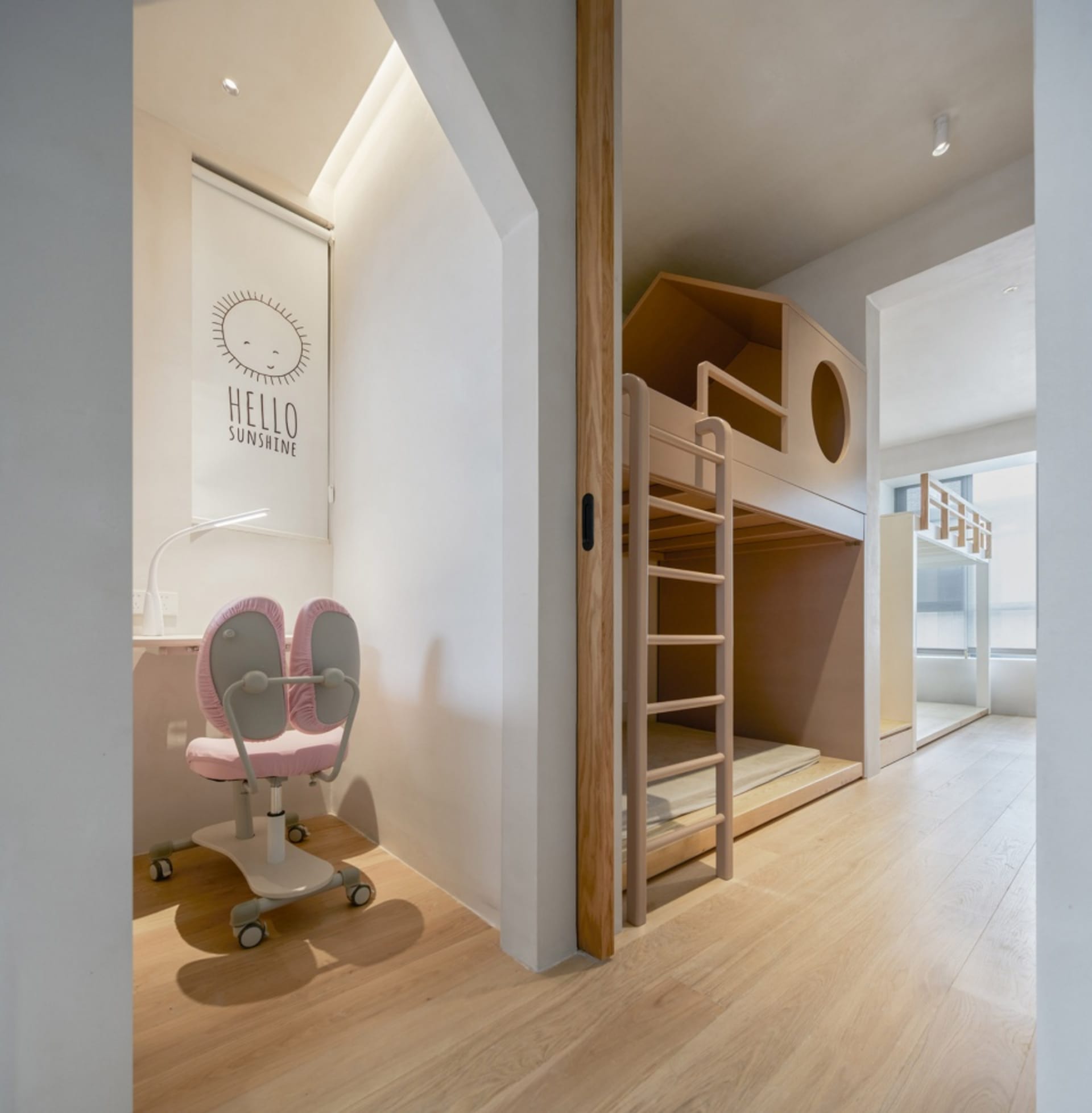 Minimalist children's bedroom with wooden bunk bed.
