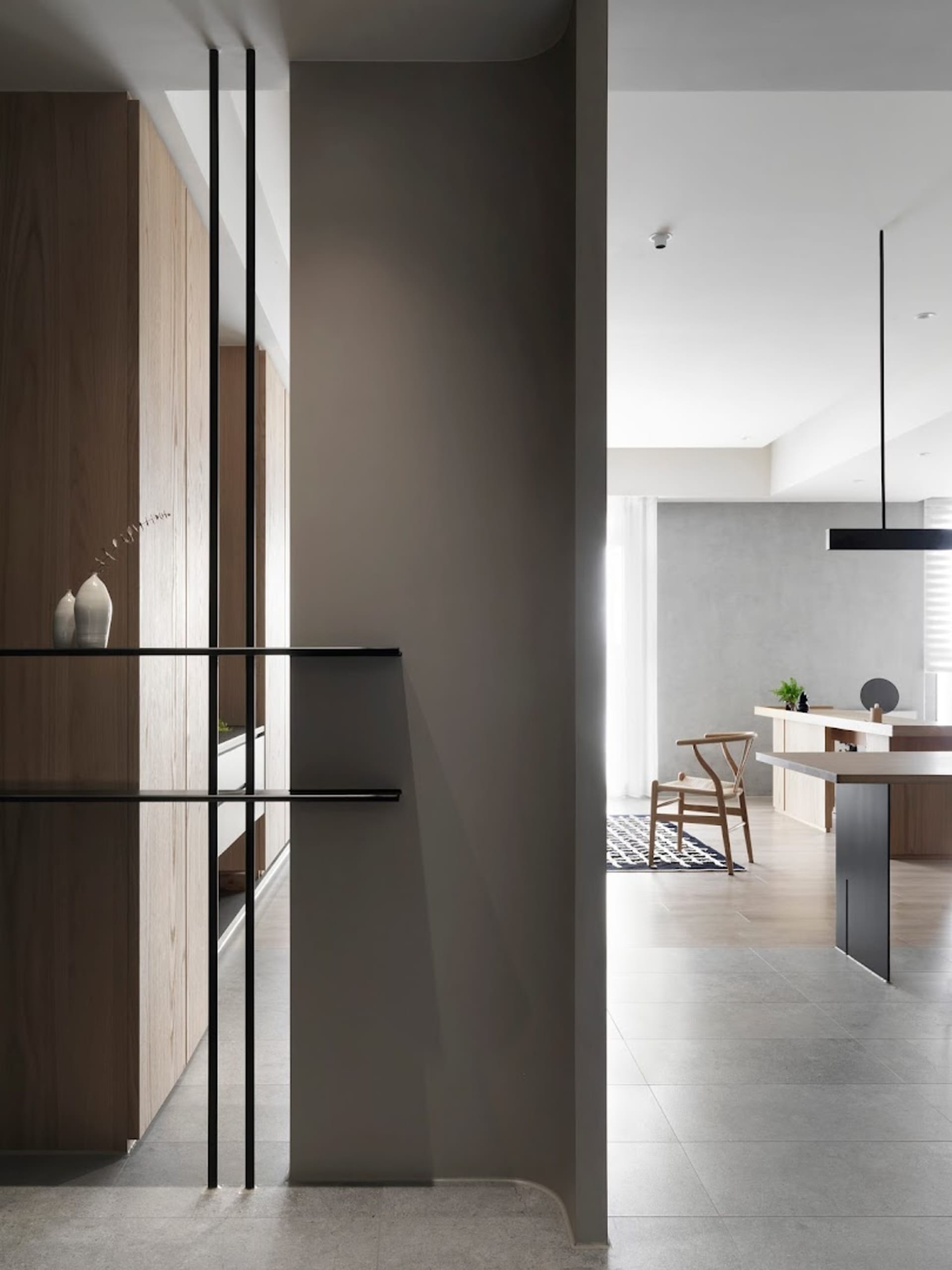 Modern kitchen featuring concrete and wooden furniture.