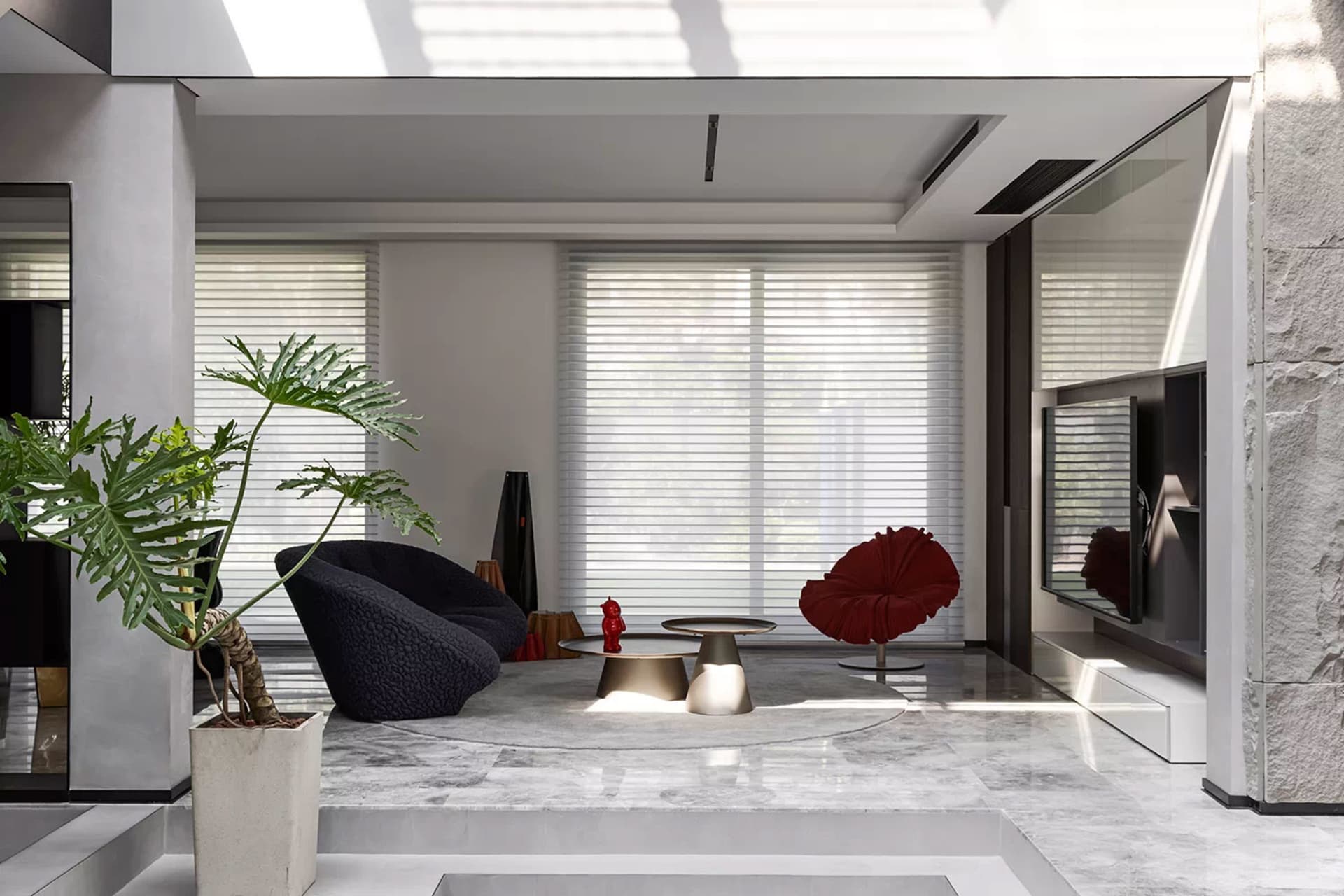 Modern minimalist living room with marble floors, minimalist furniture, and large windows